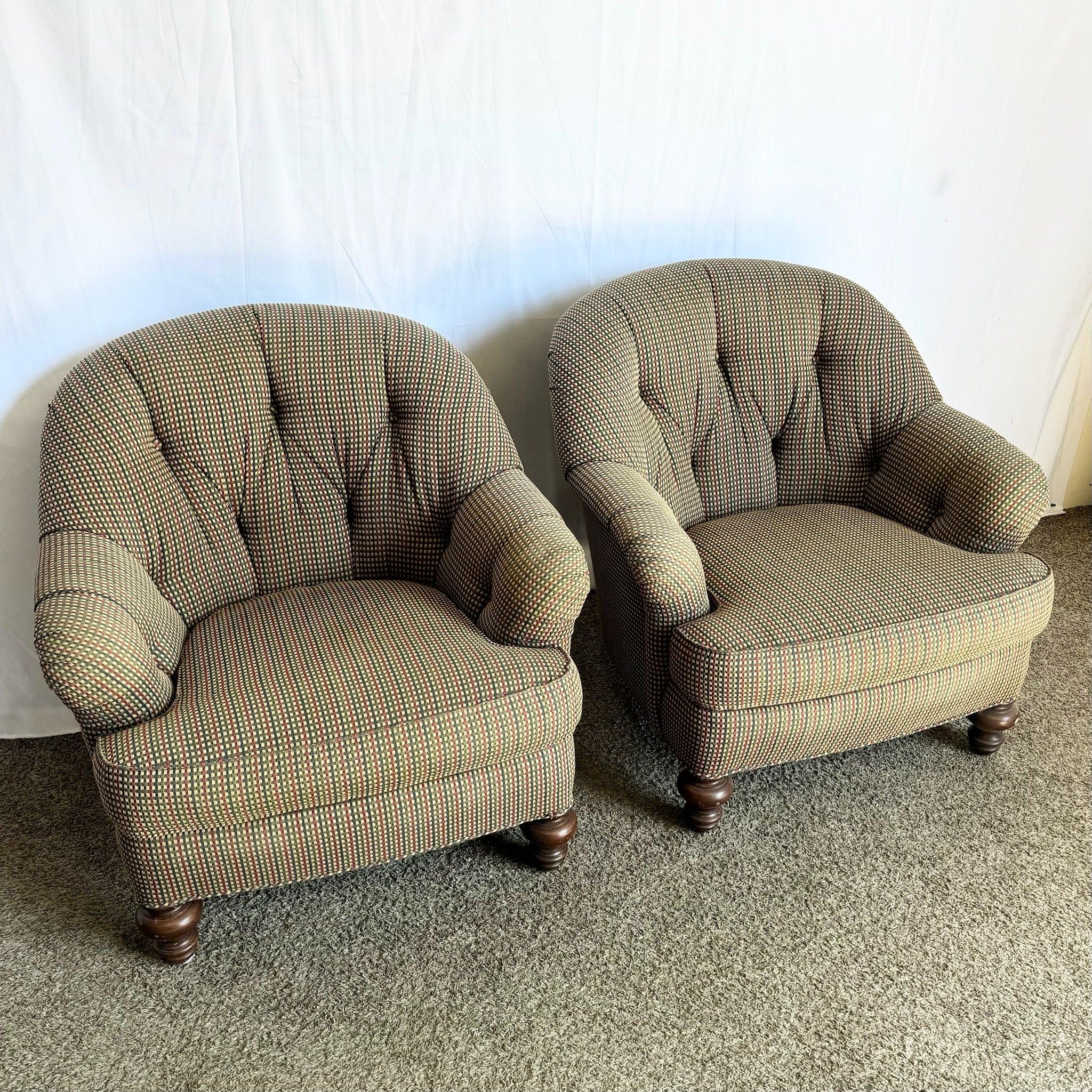 Pair of Vintage Regency tufted lounge chairs by Sherrill, featuring red, blue, and tan upholstery with rolled arms and cabriole legs for timeless elegance.
 
 Some wear to the feet as shown in the photos.
 
 We sell items as acquired, without