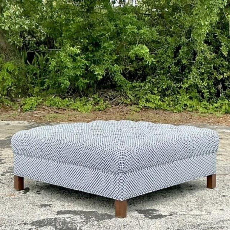 Add a touch of opulence to your living space with the American style Vintage Regency Tufted Square Ottoman. This elegant piece features classic tufting and rich upholstery, embodying the grandeur of Regency design. Perfect as a chic footrest, coffee