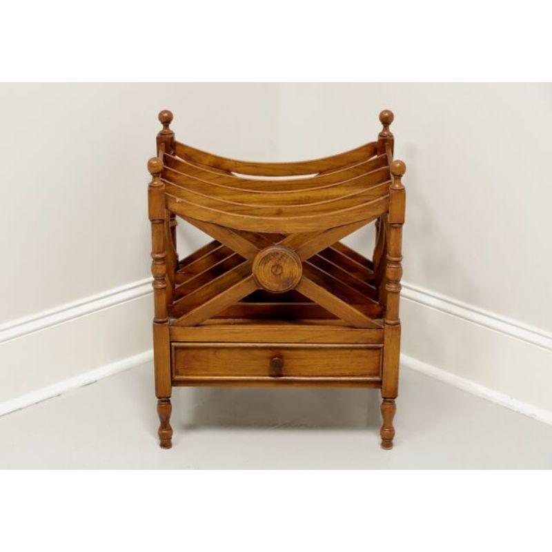 A Canterbury magazine rack in the Regency style, unbranded. Solid walnut, decorative 