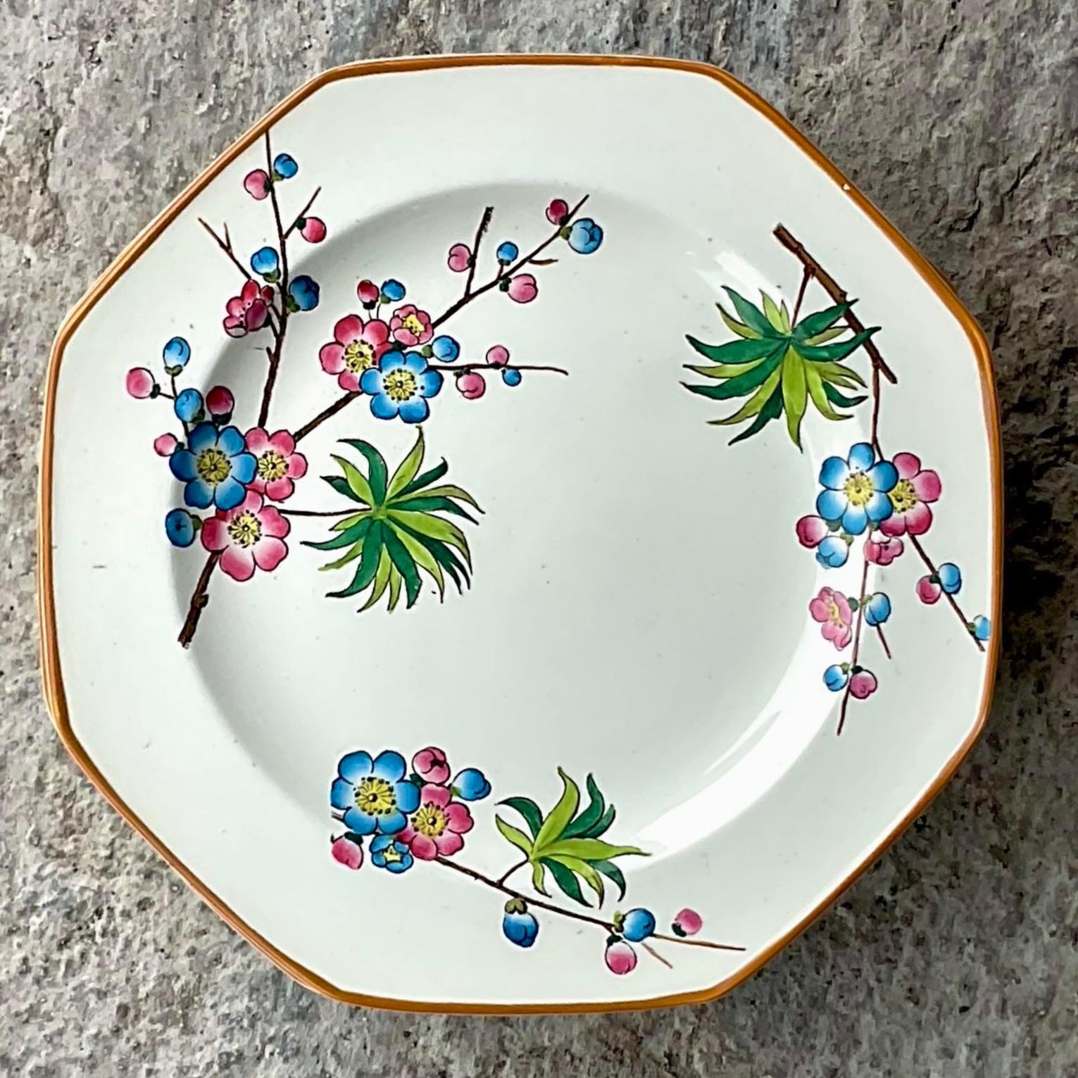 A stunning set of 8 vintage Luncheon plates. Made by the iconic Wedgwood group in England and stamped on the bottom. A brilliantly colored Spring Blossom design with charming palm trees. Acquired from a Palm Beach estate.