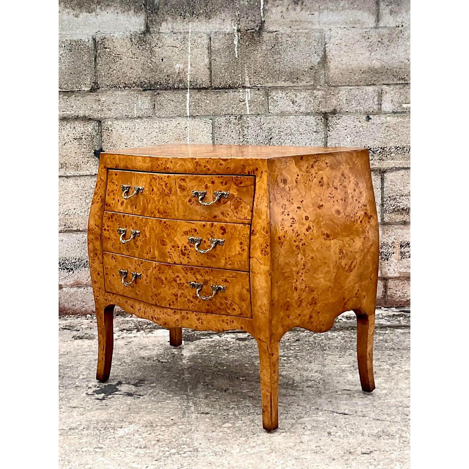 Incredible vintage William Switzer Regency commode. A gorgeous burl olive wood cabinet with lots of grain detail. Brass hardware pulls. Finished on the back so can sit comfortable with all sides exposed. Made in Italy. Acquired from a Palm Beach