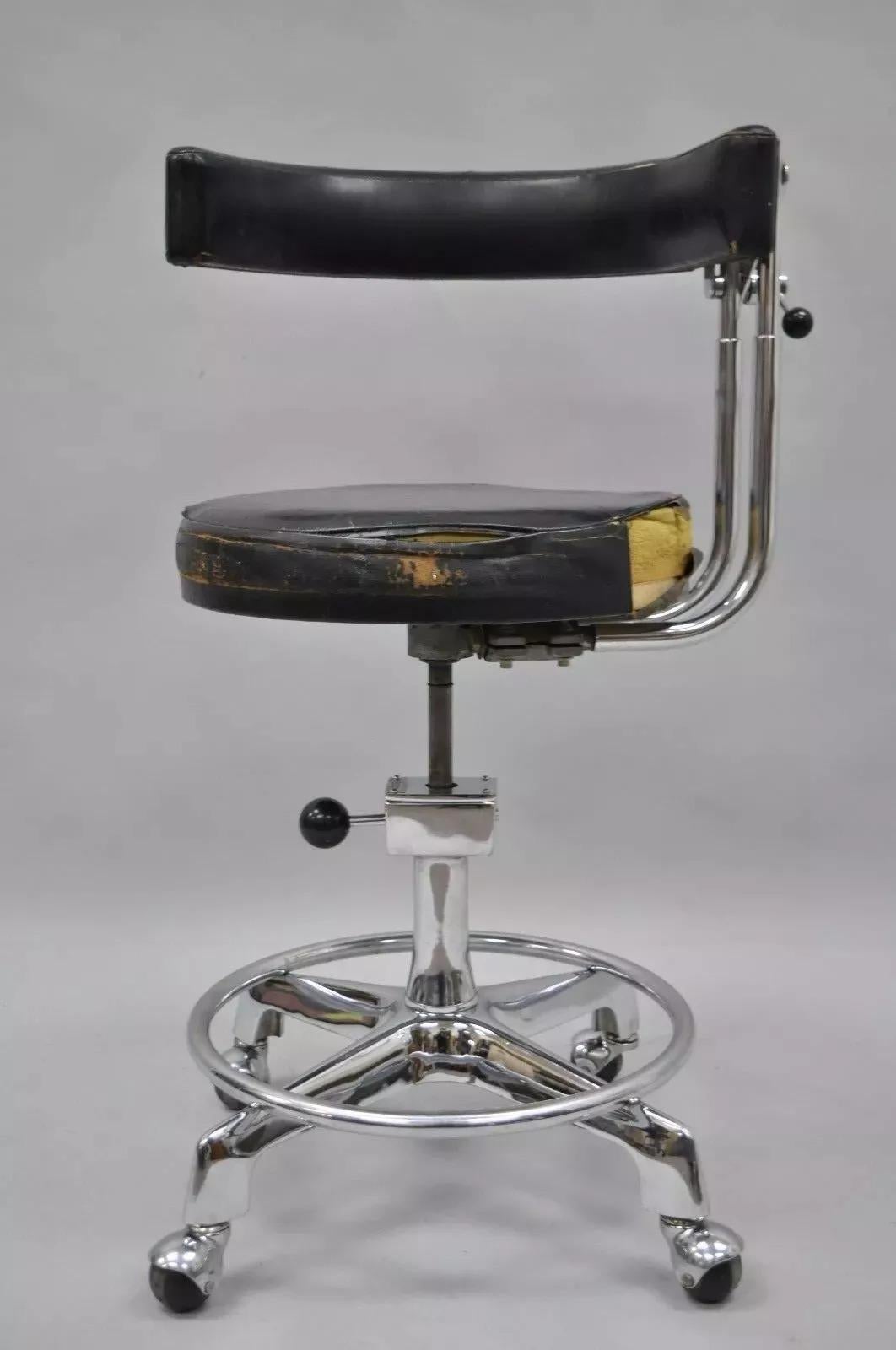 Vintage Reliance F&F Koenigkramer Medical Chair Dental Exam Stool Ophthalmic. Item features a heavy chrome metal frame, rolling casters, wrap around arm, original metal tag. Circa Early 20th Century. Measurements: 32