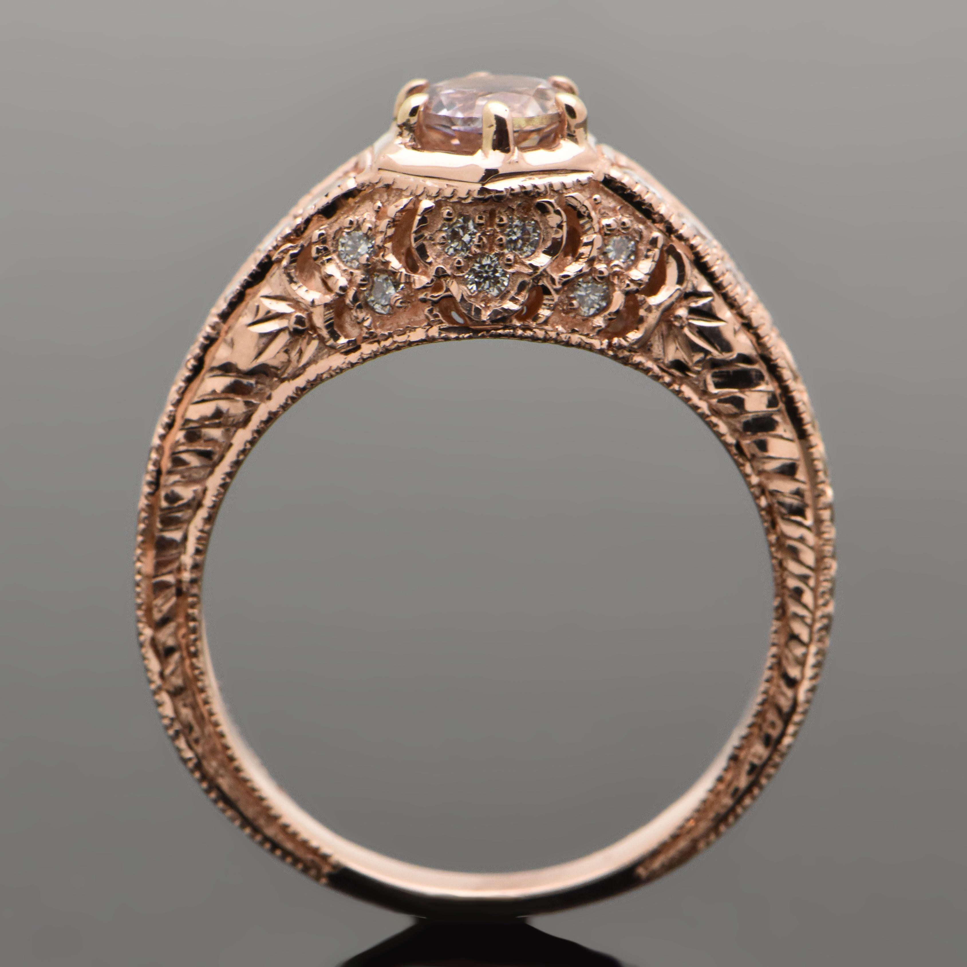 This vintage remake 14kt rose gold ring is set with a round brilliant-cut pink sapphire at an estimated weight 0.30ct. Shoulders are accented with 3 diamonds on each side and accent diamonds throughout setting. Diamonds are an estimated  0.17 cttw.