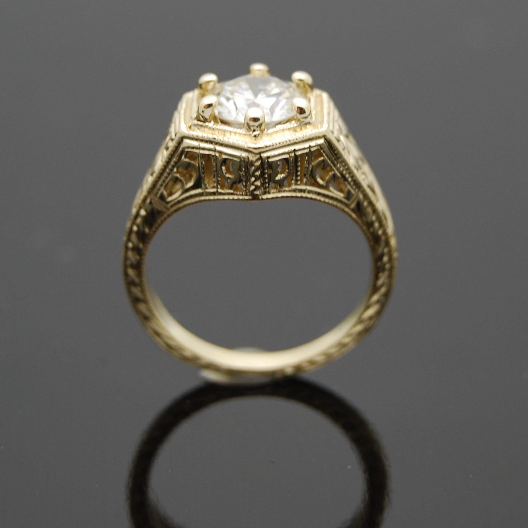 14kt Yellow Gold Diamond Ring. This vintage remake Art Deco Style setting features a unique hexagon shape set with a beautiful round brilliant cut diamond, delicate carving and milgrain details. 

This item is a custom order only. Price is for the