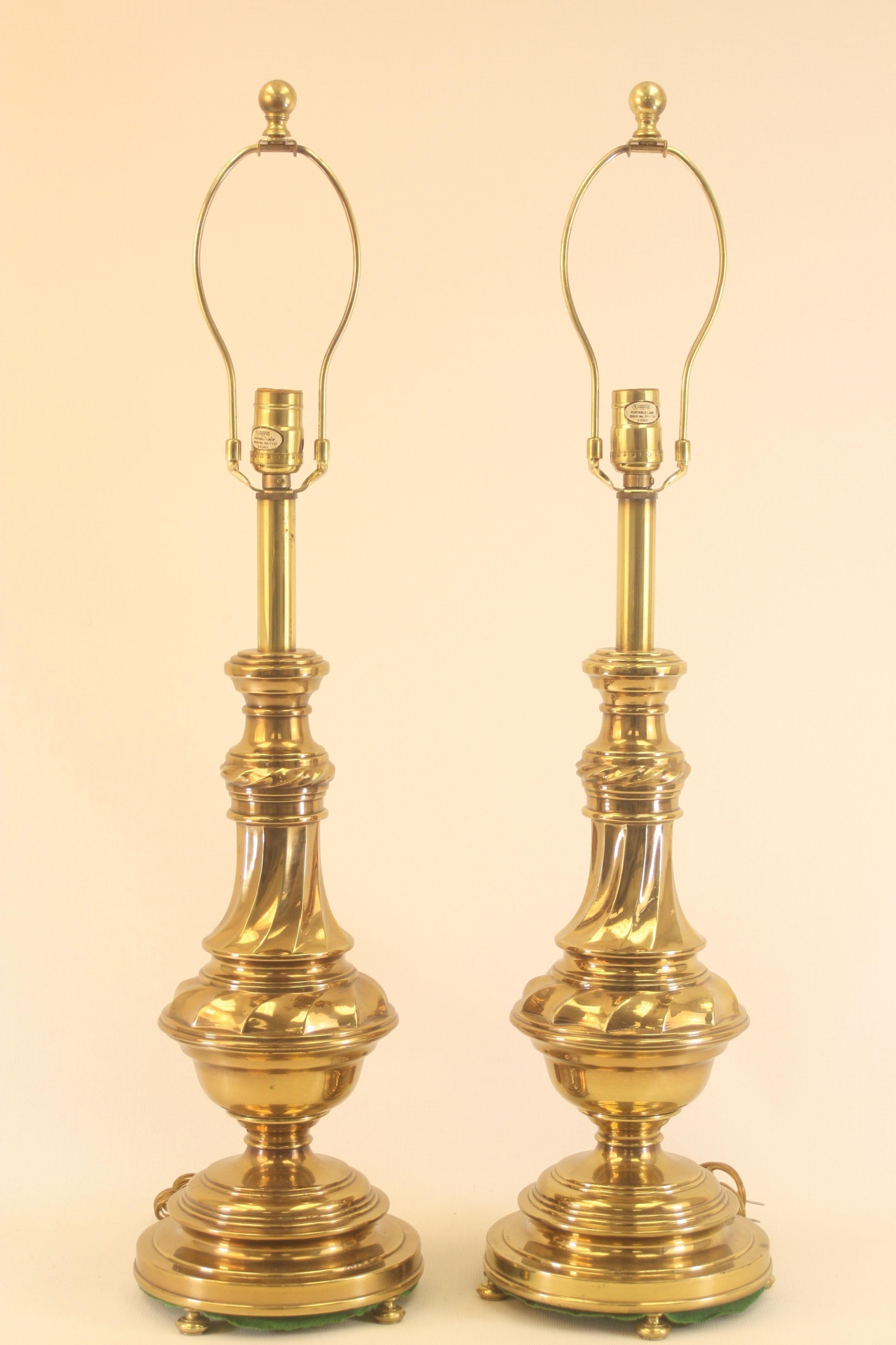 This is a fabulous pair of late 1960s heavy solid brass Rembrandt table lamps.