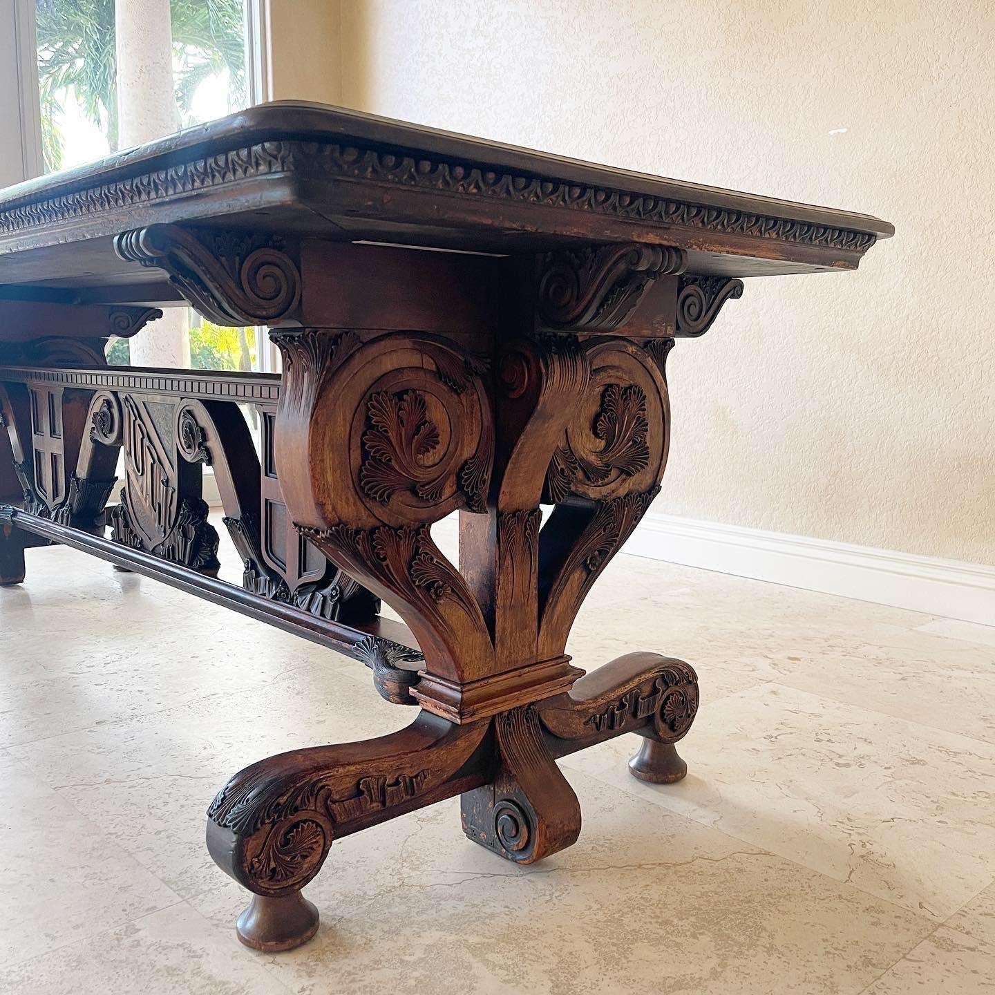 Vintage Renaissance Revival Crested Wooden Dining Table for Philco Corp In Good Condition For Sale In Delray Beach, FL