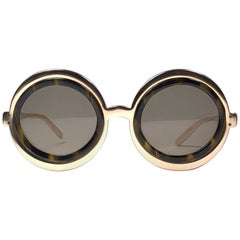 Gafas de sol vintage Renauld redondas con montura dorada y lentes marrones de 1980 Made in USA