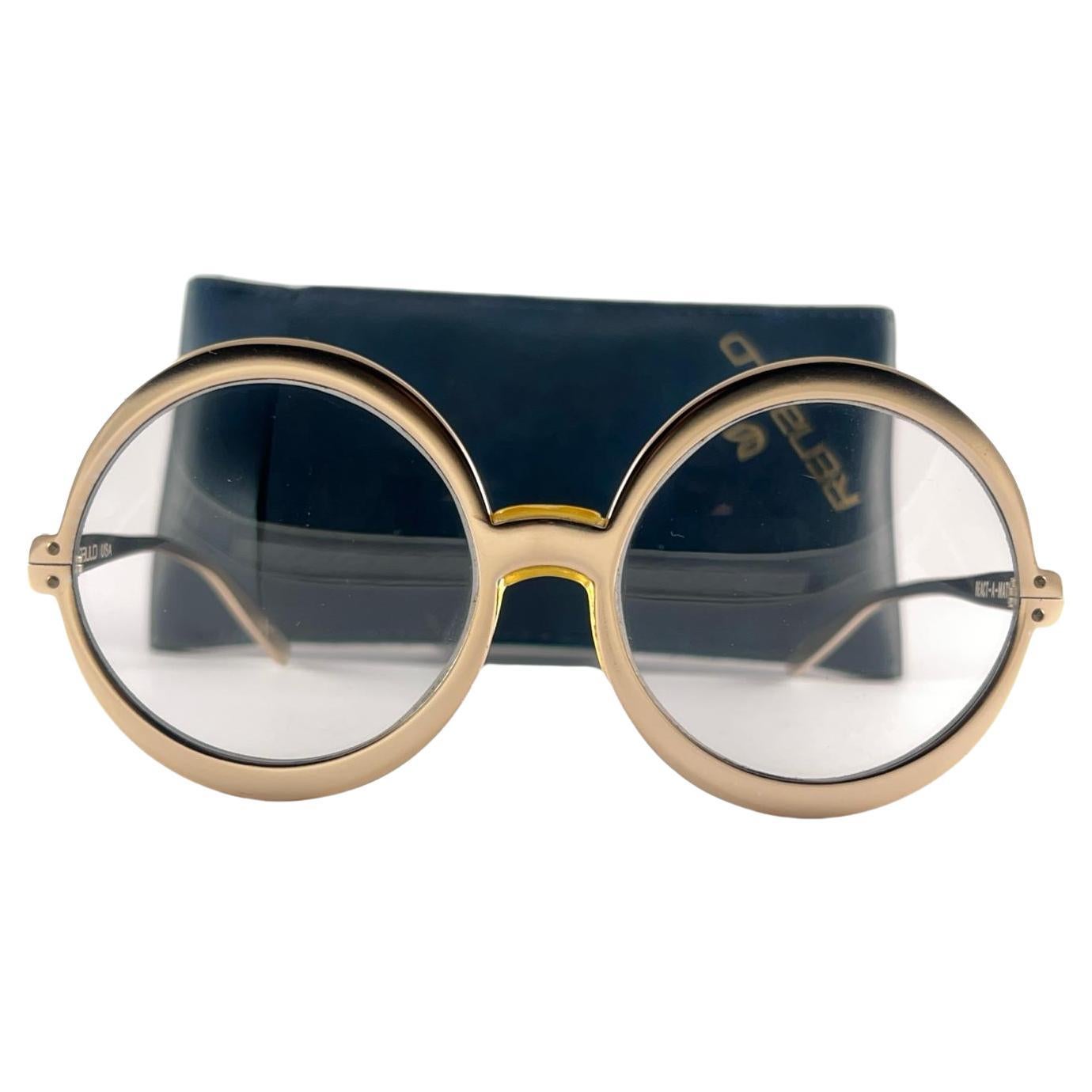 Gafas de sol vintage Renauld redondas doradas metalizadas años 80 Made in USA en venta
