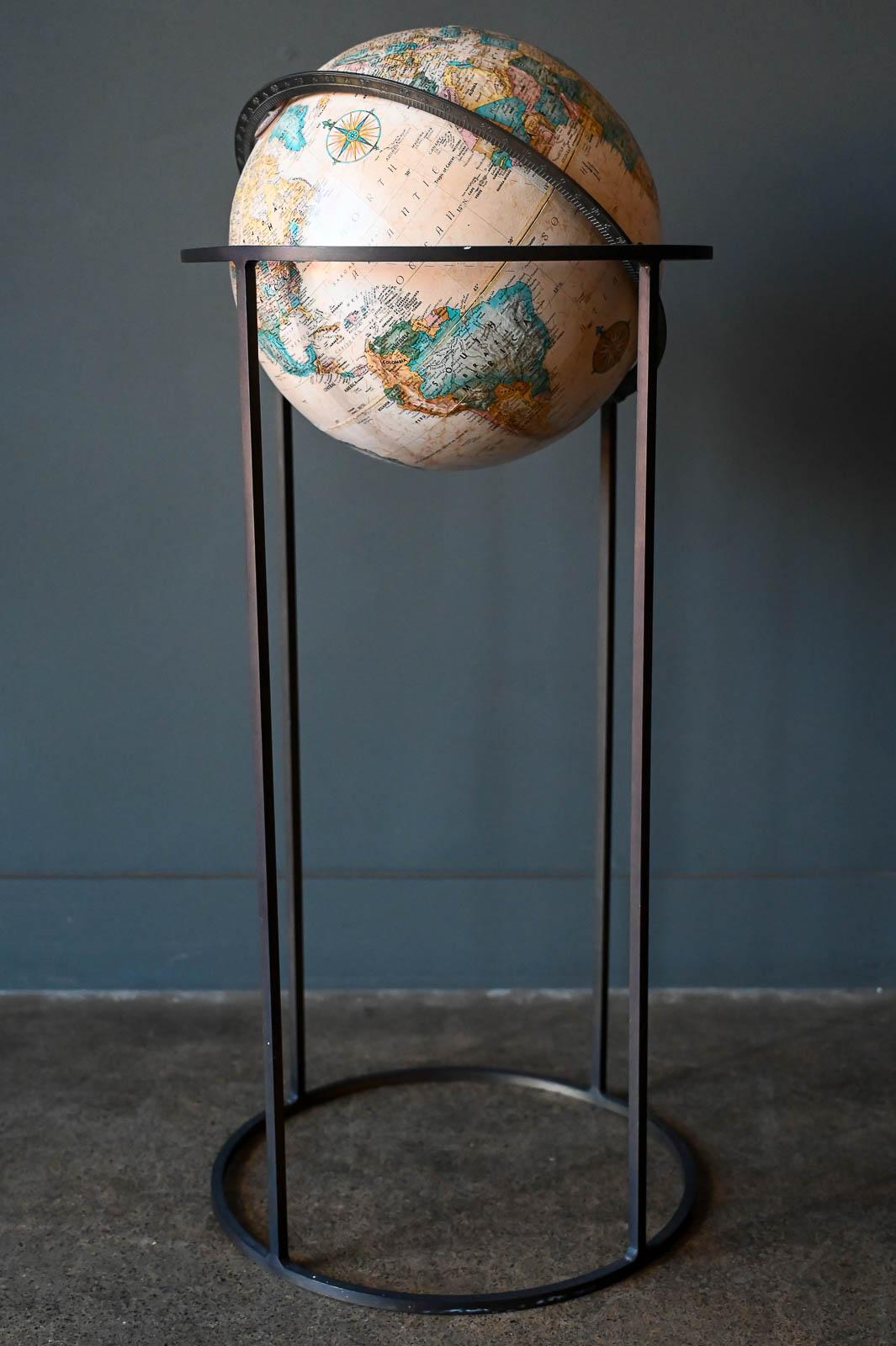 Vintage Replogle articulating globe on brass stand, ca. 1970. Globe dates to the late 60's, early 70's based on geographic name changes, etc. Beautiful condition with brass stand and wonderful patina. The globe articulates and moves freely with