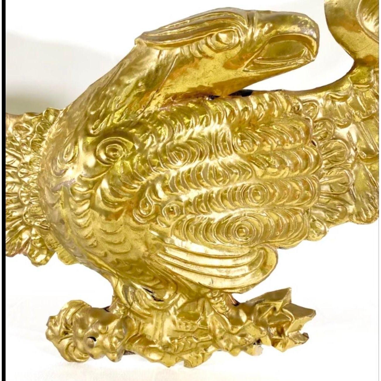 A stunning vintage early 20th century repousse American eagle. The eagle is made of hollow brass. The eagles feet are clasping arrows. Acquired at a Palm Beach estate.