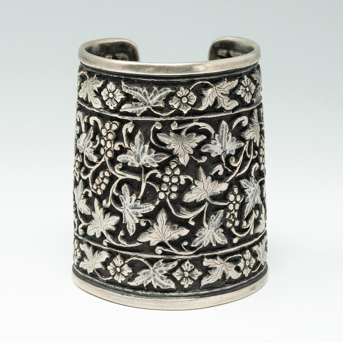 Vintage Repoussé Grape Cluster Cuff, India

A handsome heavy repoussé silver cuff with grape clusters and leaves on a blackened background, which could be influenced by Iranian Pateh. It measures 3-3/8 inches high and tapers slightly towards the top