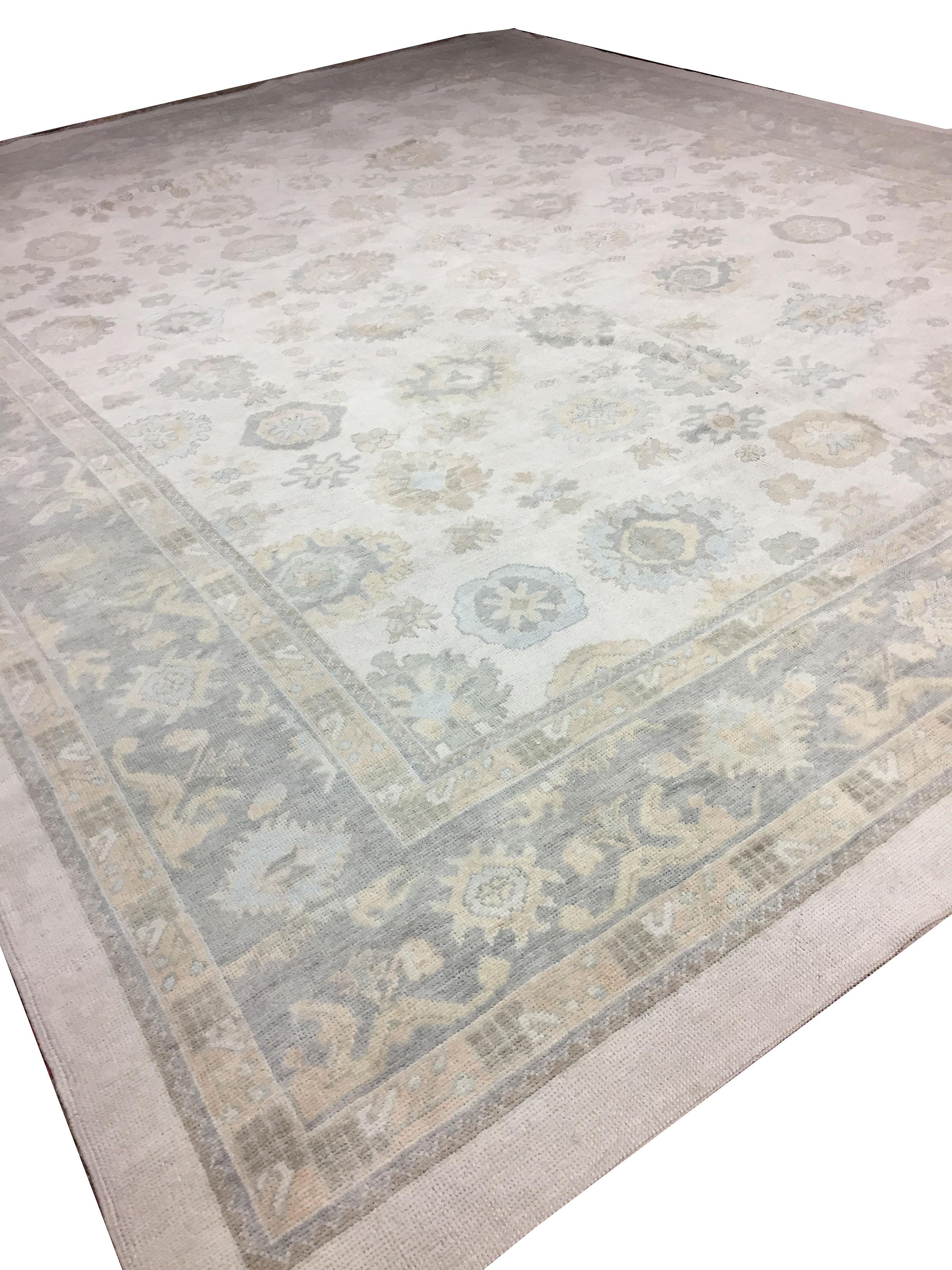 13' x 17'. Handwoven in Turkey using the finest of materials this is a classic recreation of an Oushak rug in soft colors.
