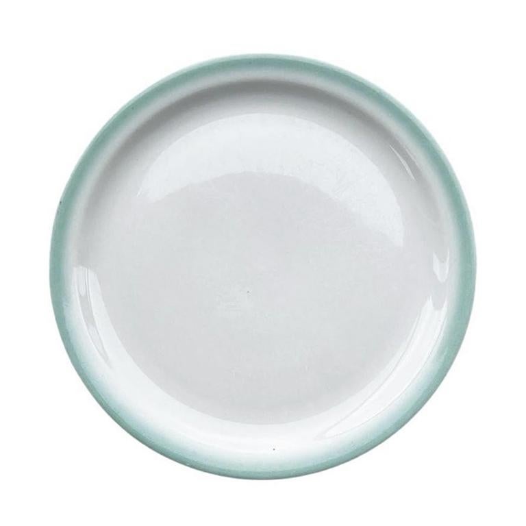 We love restaurantware. So when we are out scouting, and we find a piece, we always grab it! This set of dinnerplates by Shenango are in the most beautiful ombre green around the edges. The centers are white and the bottoms are labeled in black with