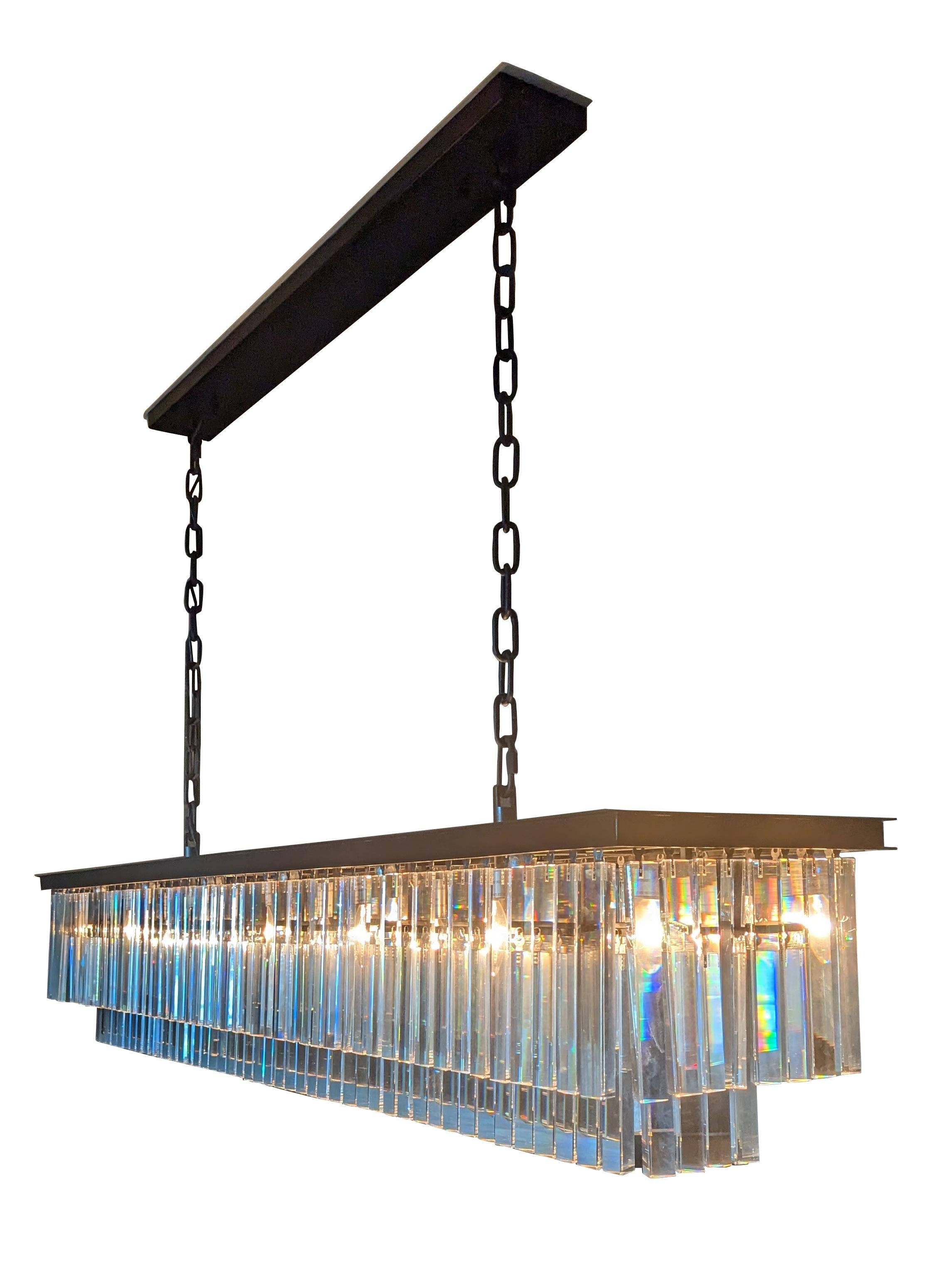 Vintage 1920S Odeon rectangular iron and crystal chandelier.

Inspired by the Art Deco style of 1920s Paris, our collection from Timothy Oulton captures the period's fascination with geometric forms. Masterfully refracting the light, hundreds of