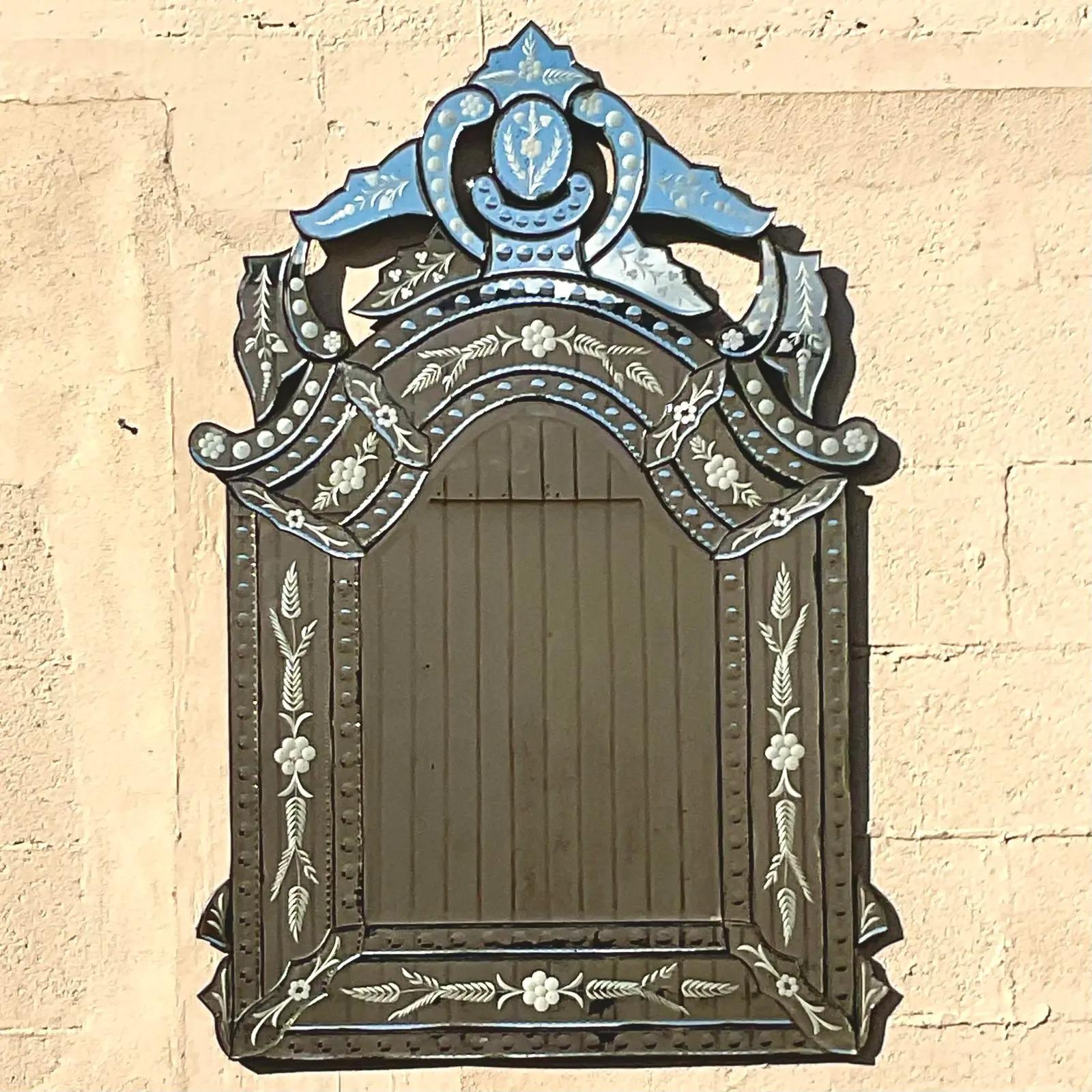 A fantastic vintage Regency wall mirror. Made by Restoration Hardware. The large French Rococo style with all the beautiful etched detail. Acquired by a Palm Beach estate.