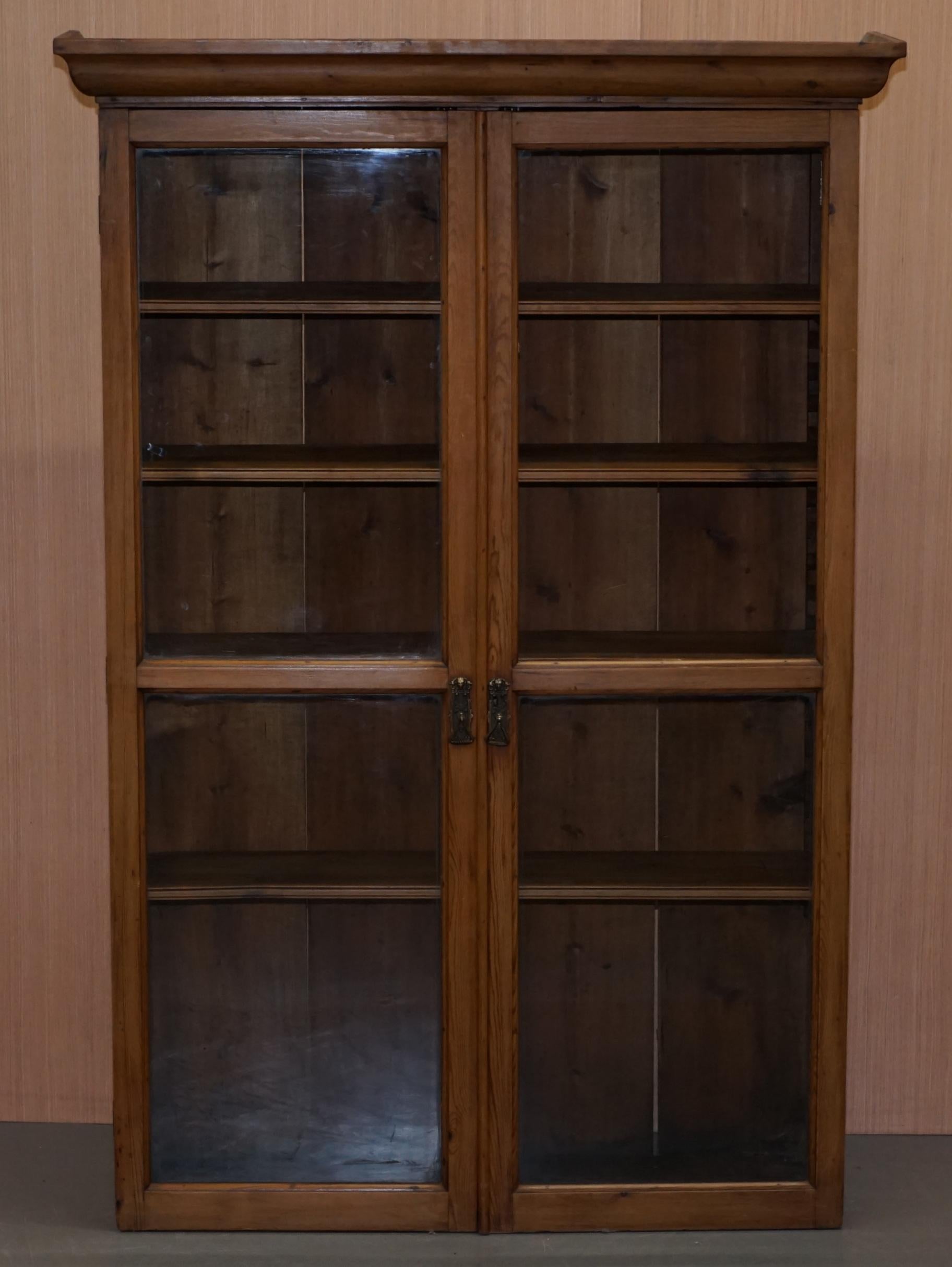 We are delighted to offer for sale this lovely solid pine library bookcase with glass doors and adjustable shelves

A good looking and well made bookcase, circa 1940, we have cleaned waxed and polished it from top to bottom

This can also be