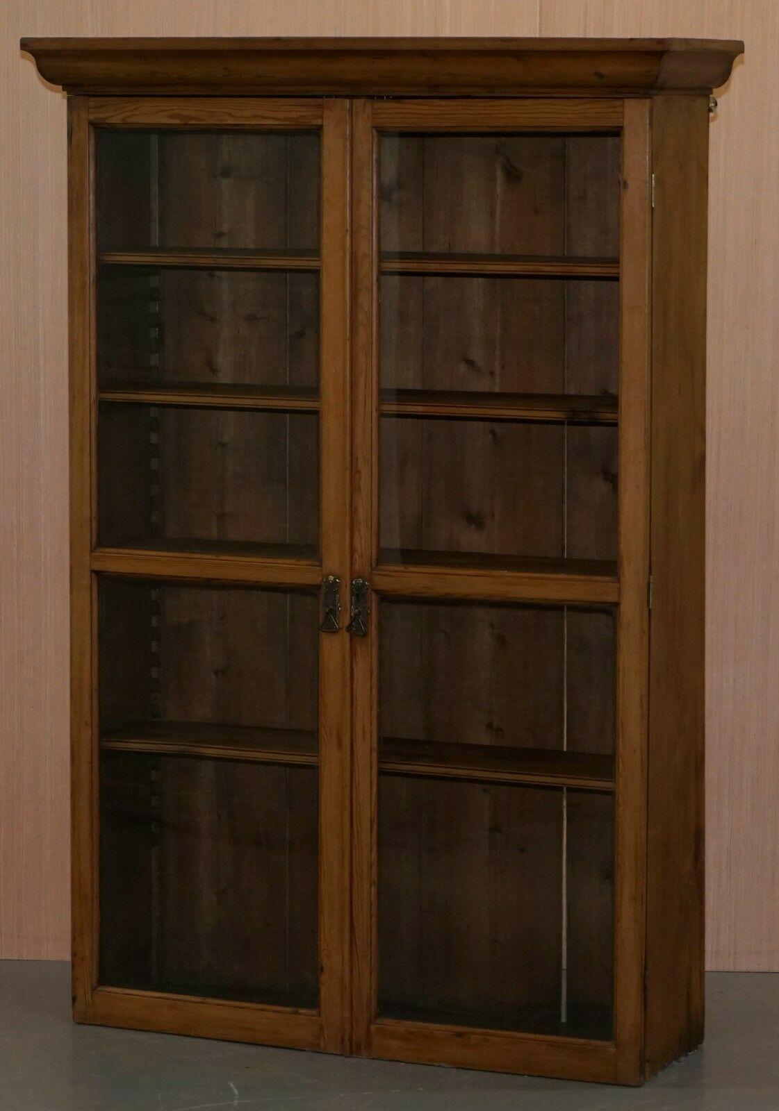 We are delighted to offer for sale this lovely solid pine library bookcase with glass doors and adjustable shelves.

A good looking and well-made bookcase, circa 1940, we have cleaned waxed and polished it from top to bottom.

This can also be