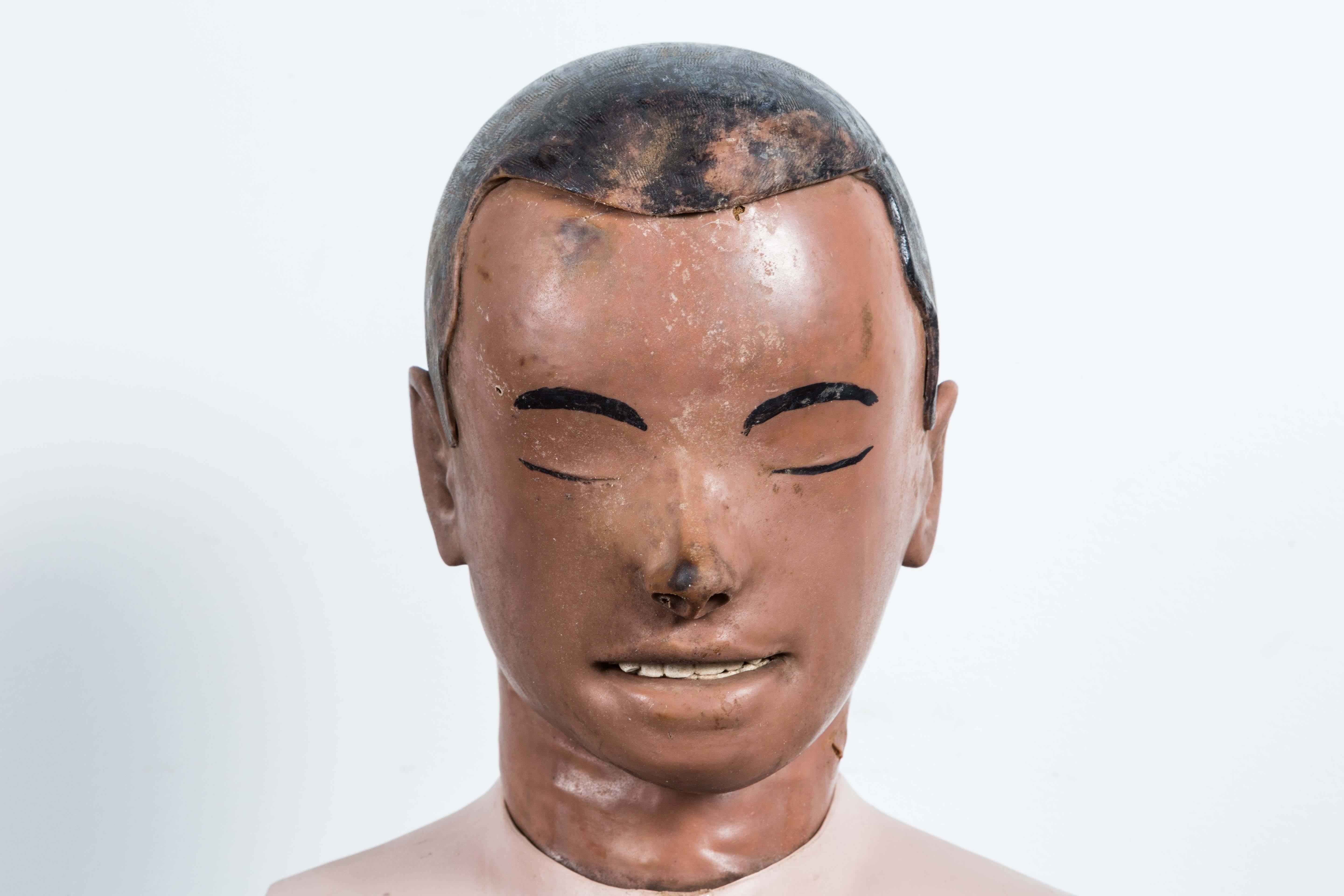 Vintage resuscitation man's head. Open mouth connected to tubes that would raise chest for CPR training. Resuscitation dummies were invented in the 1950s by Asmund Laerdal. Laerdal has a life-long devotion to innovative medical simulation and