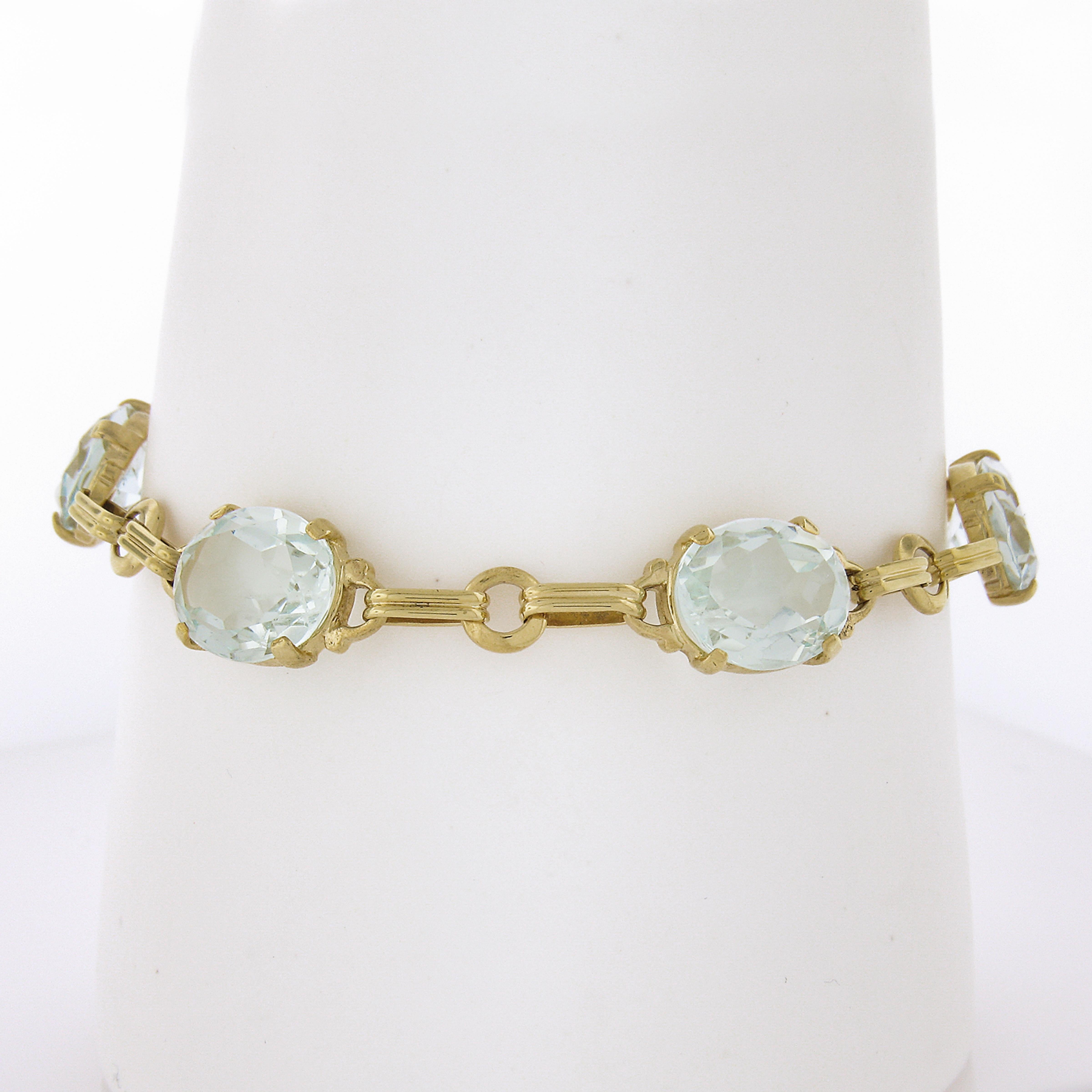 You are looking at a gorgeous, retro vintage bracelet crafted in solid 14k yellow gold and features well alternated grooved open oval & round links with 5 beautiful aquamarine accents that total approximately 21 full carats in weight. The links