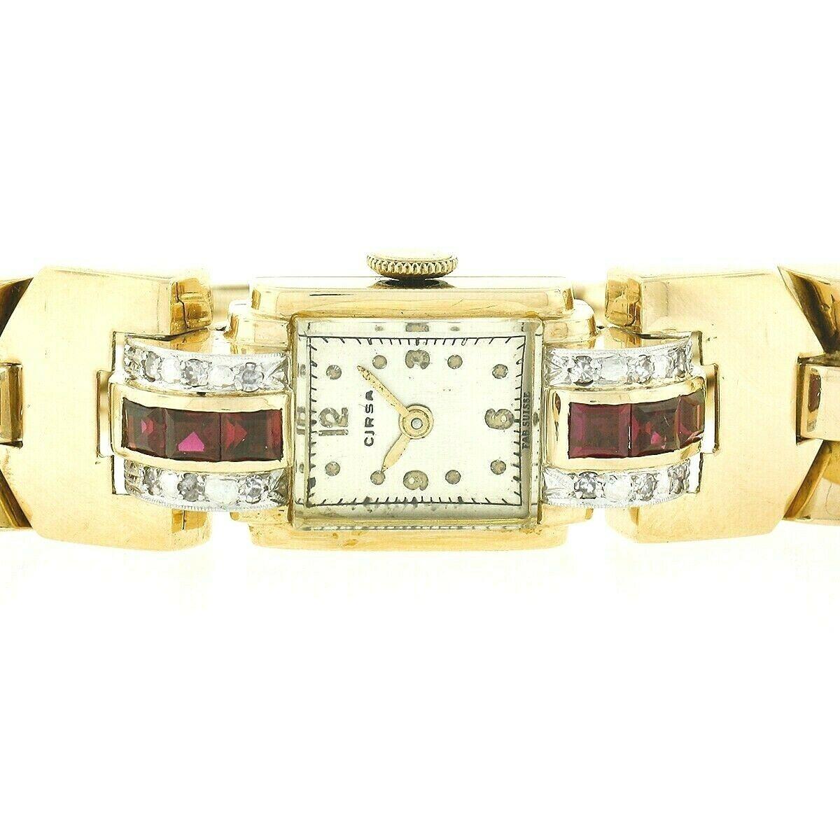 This gorgeous vintage wrist watch was crafted in Switzerland from solid 14k yellow gold during the retro period. It features vivid blood red synthetic rubies and natural round single cut diamonds accenting the dial at the top and bottom. The