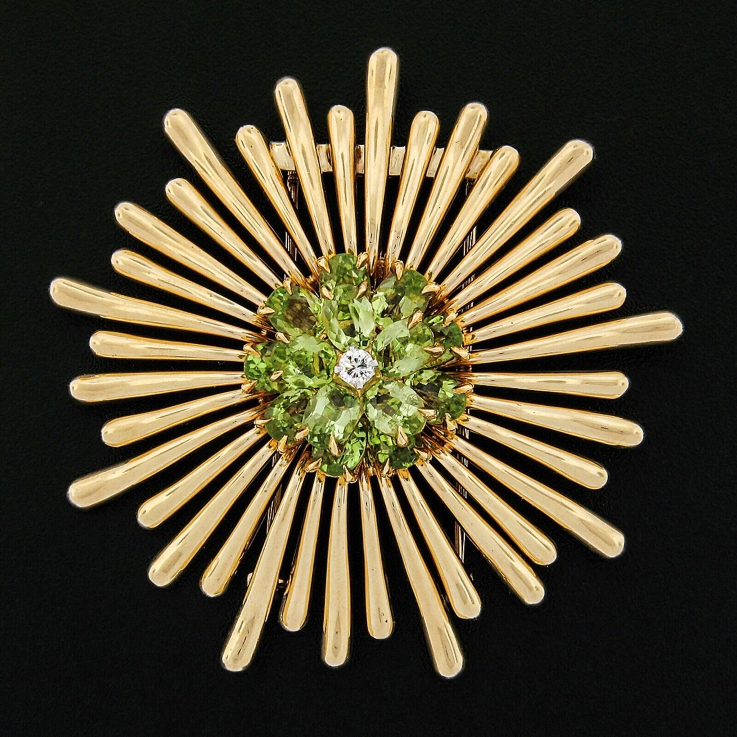 This large, breathtaking retro brooch is crafted in solid 14k rosy yellow gold and features a truly outstanding spray design which is set with approximately 9.5 carats of oval brilliant cut genuine peridot stones. The stones display very fine and