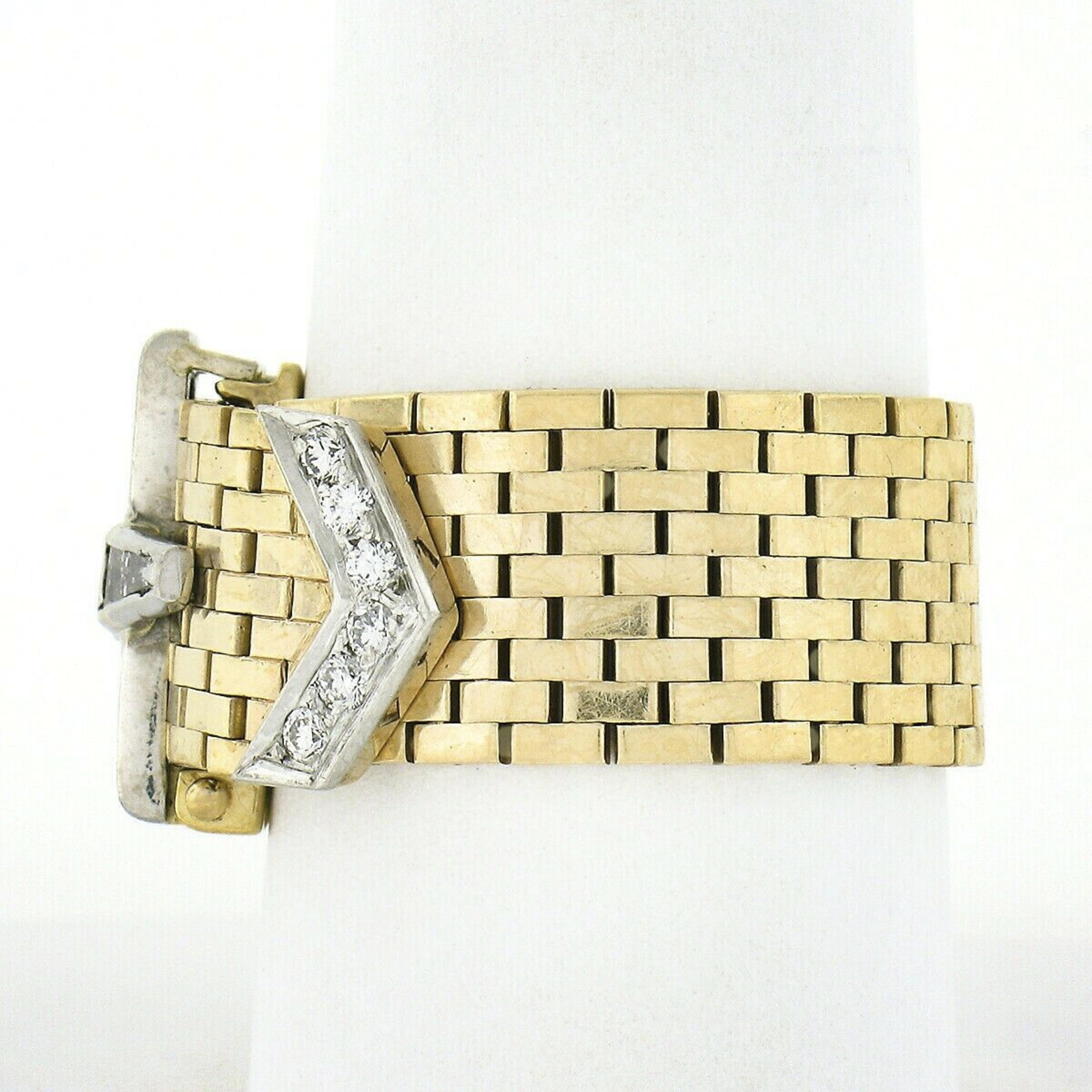 This incredible vintage buckle band ring is crafted from solid 14k yellow gold with solid platinum at the 