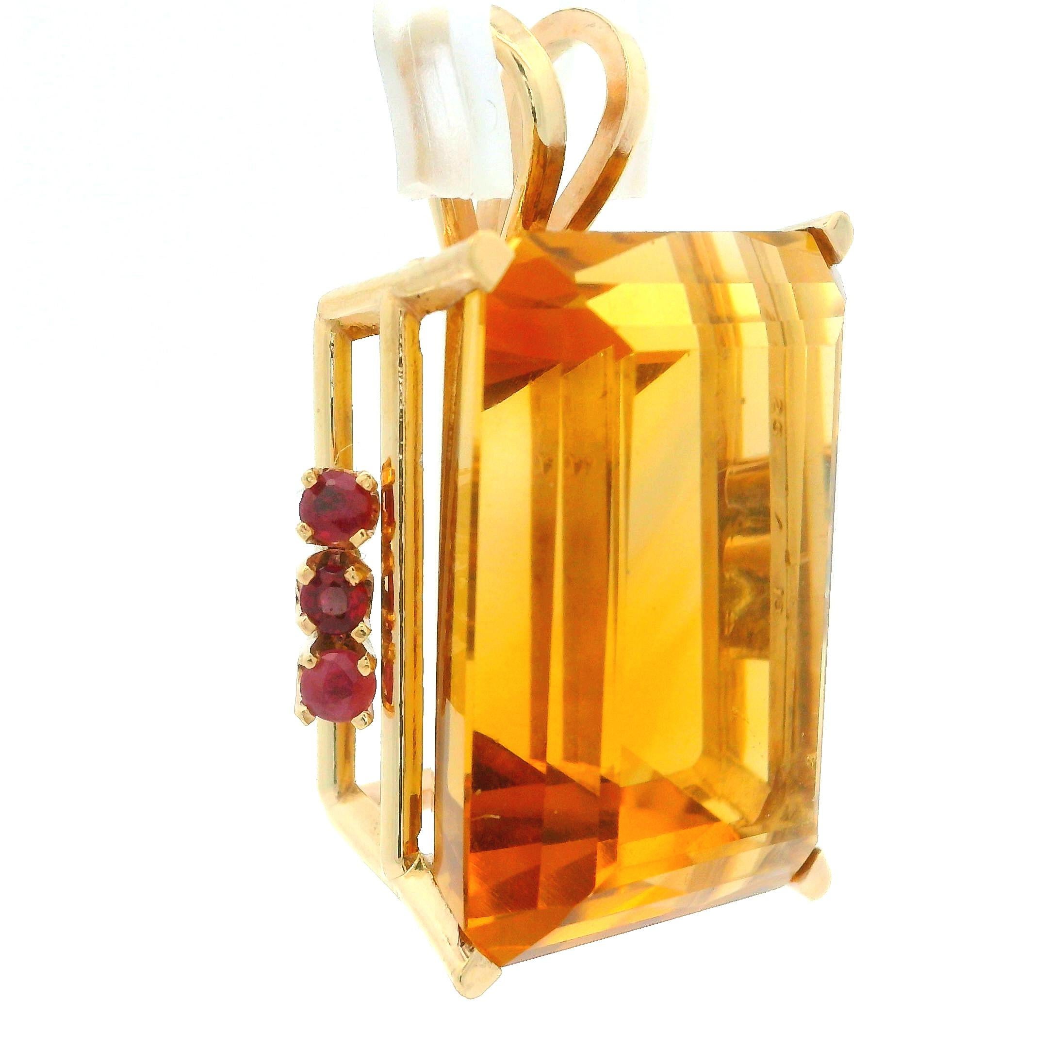 --Stone(s):--
(1) Natural Genuine Citrine - Emerald Cut - Panel Prong Set - Nice Orange Color - 24.8x18mm (approx.)
(6) Natural Genuine Rubies - Round Brilliant Cut - Prong Set - Red Color - 0.30ctw (approx.)

Material: 14K Solid Rosy Yellow