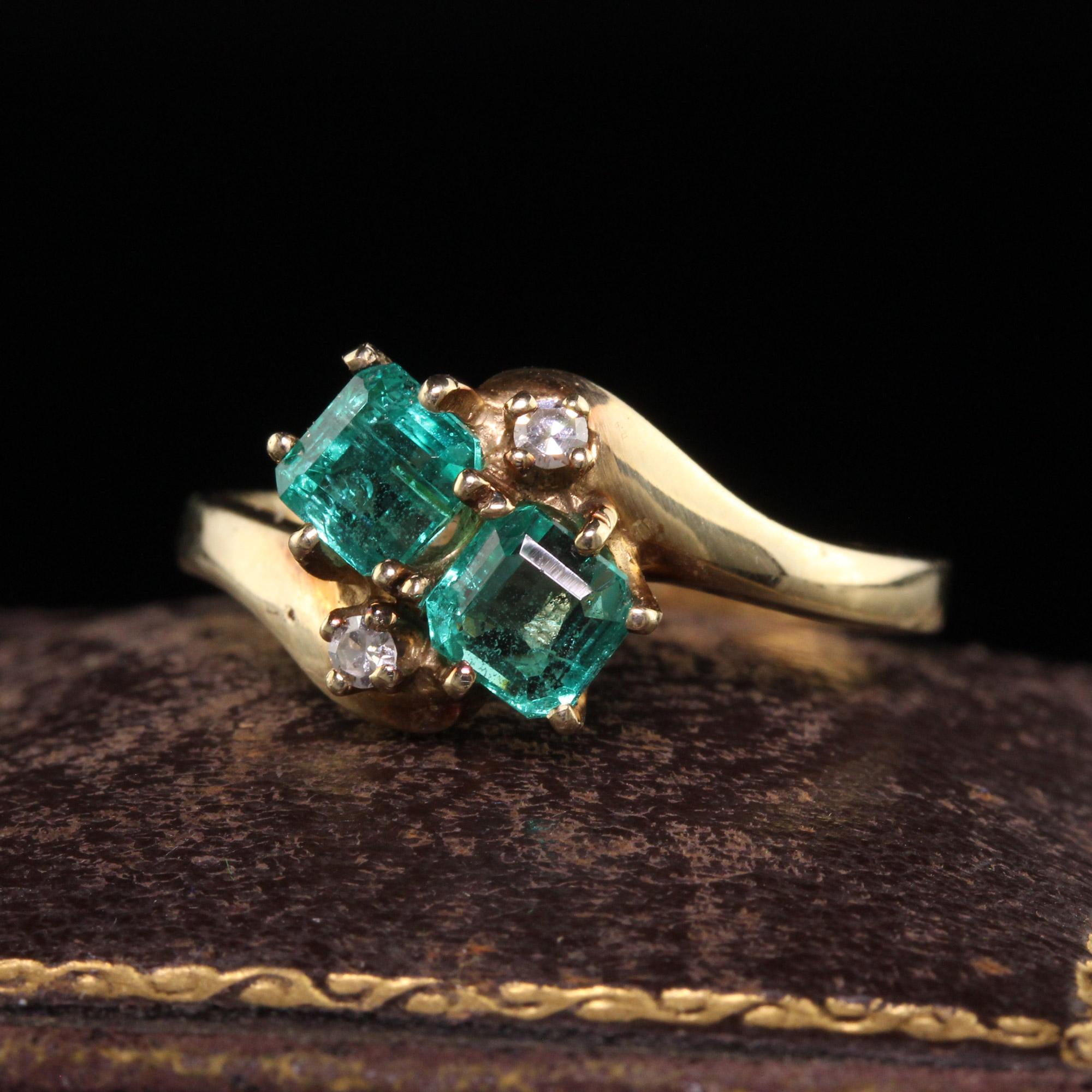 Beautiful Vintage Retro 14K Yellow Gold Colombian Emerald Toi et Moi Diamond Ring. This gorgeous ring is crafted in 14k yellow gold. The ring has two beautiful colombian emeralds on it with single cut diamonds above and below. The ring is i great