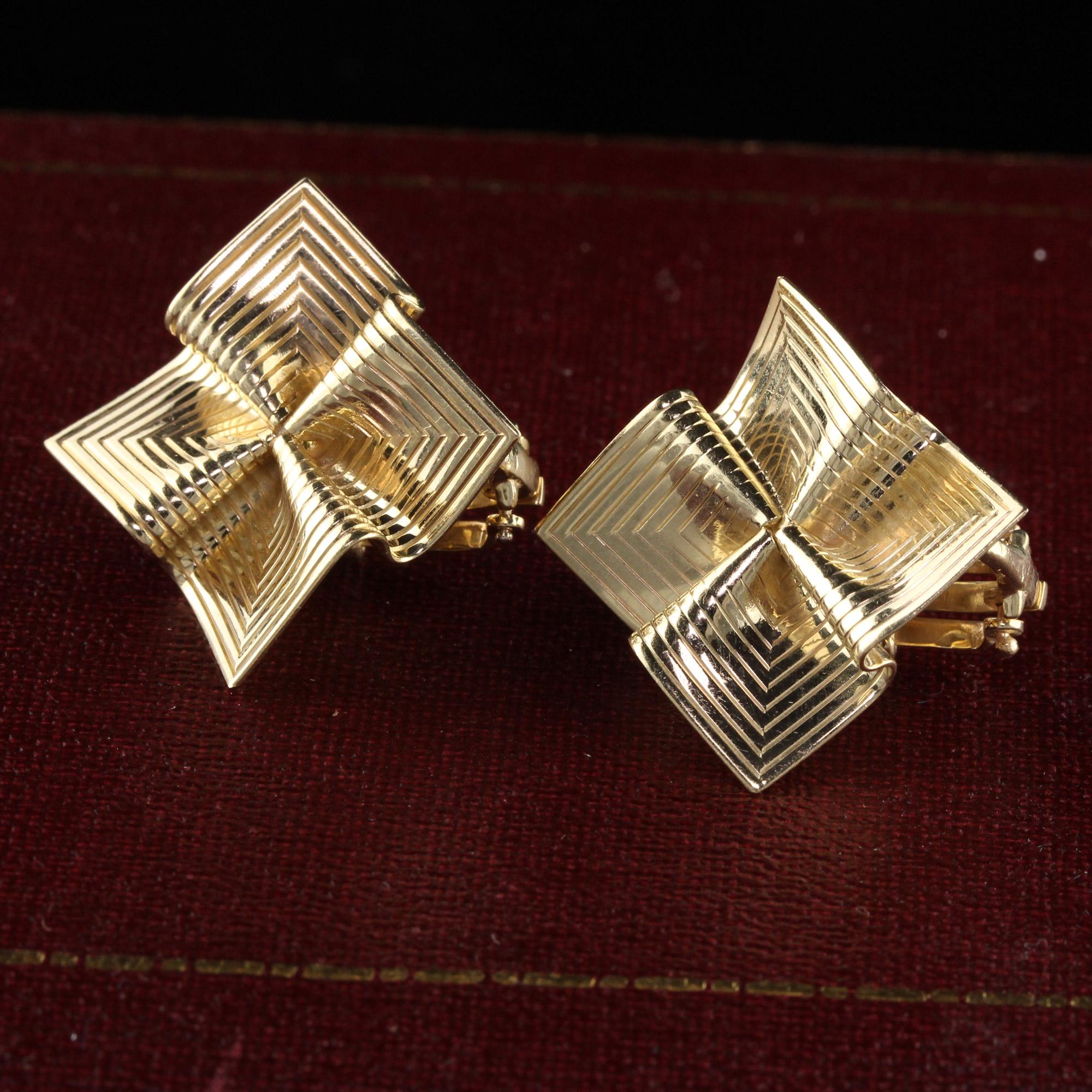 Beautiful Retro Vintage 14K Yellow Gold Origami Pin Wheel Earrings. These gorgeous Retro earrings are crafted in 14K yellow gold and have an amazing fabric like feel to them with engravings on the front. It looks like a pin wheel pattern and they
