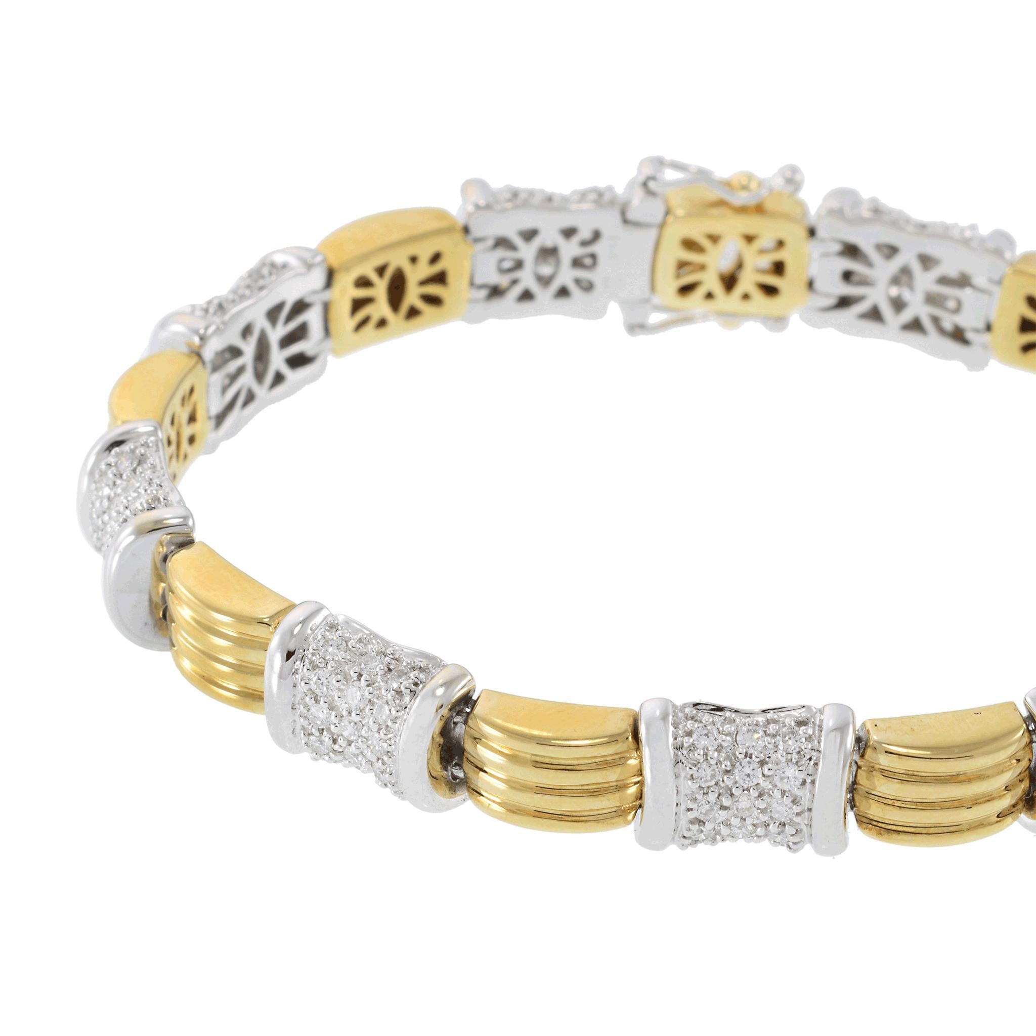 A beautifully crafted vintage Retro 14KT two-tone gold bracelet, designed with 9 distinct sections showcasing a sophisticated blend of yellow and white gold. This exquisite piece is adorned with 2.02CT-TW of G-VS/SI round brilliant-cut diamonds,