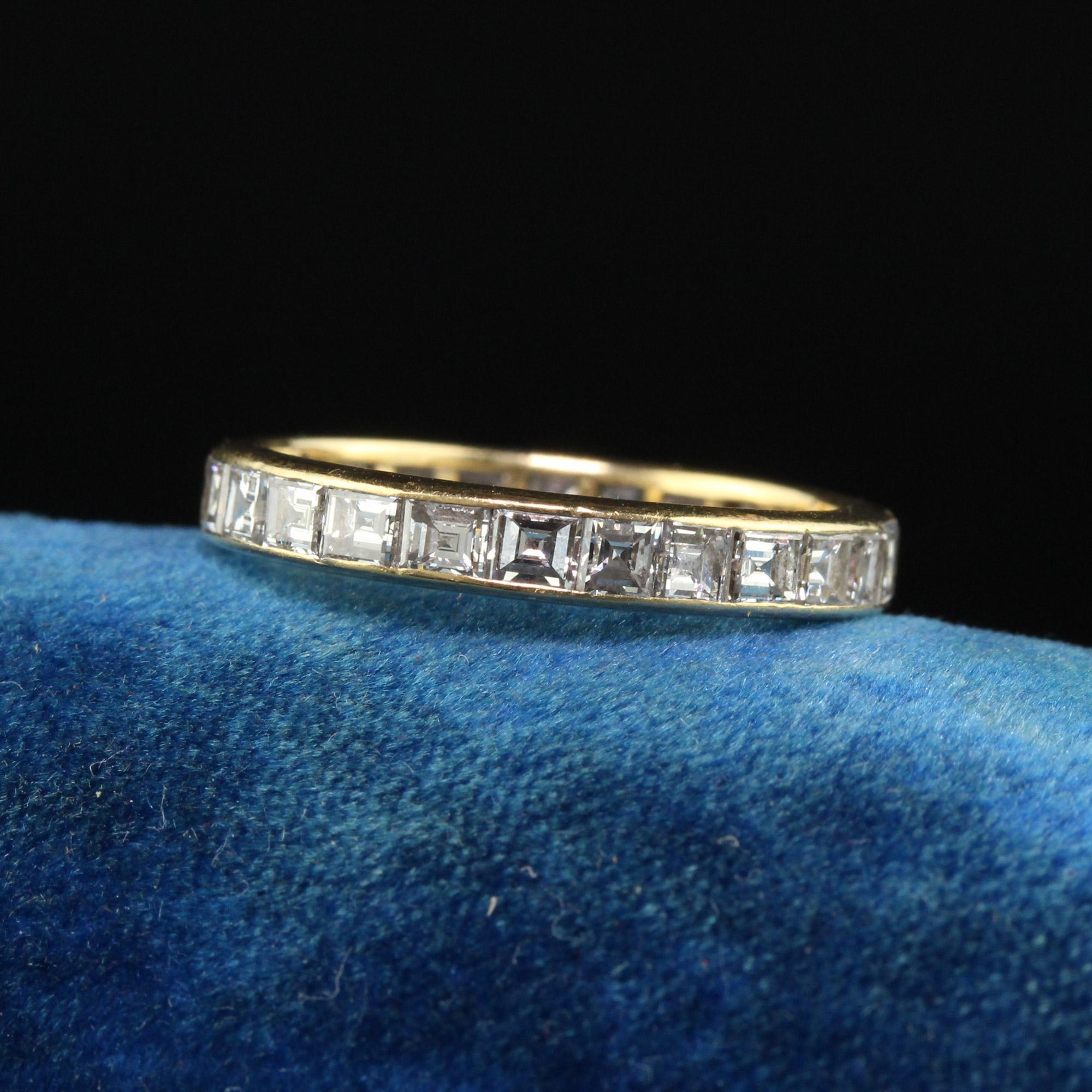 Vintage Retro 18K Yellow Gold Carre Cut Diamond Eternity Wedding Band - Size 5 1/2. This gorgeous wedding band is crafted in 18k yellow gold. There are gorgeous white carre step cut diamonds going around the entire ring and sits very low on the