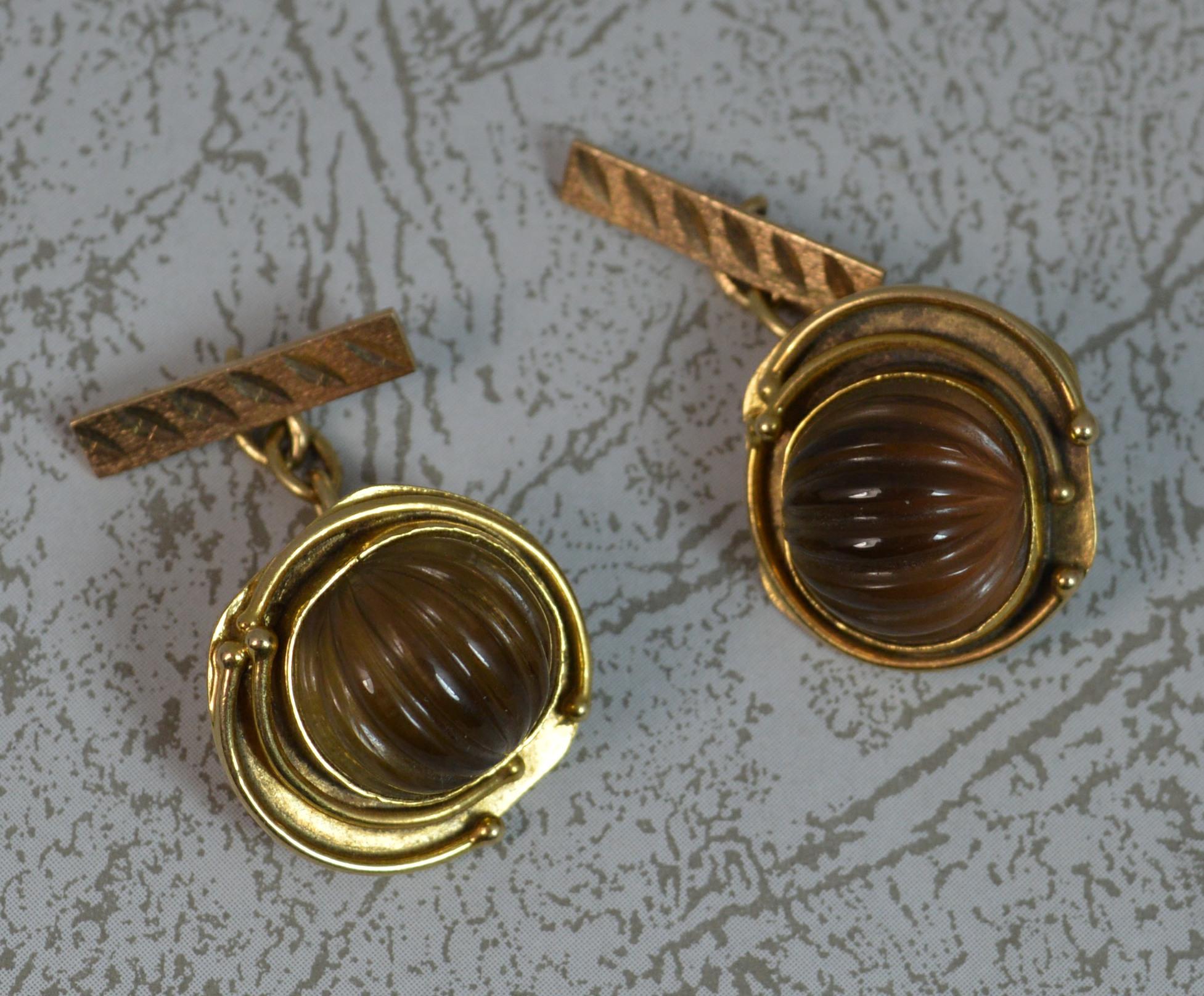 A highly unusual pair of retro cufflinks.
Solid 9 carat yellow gold example.
Designed with a single hand carved smoky quartz to one half with a gold tubing surround.

CONDITION ; Excellent. Securely set stones, issue free. Crisp gold, issue free.
