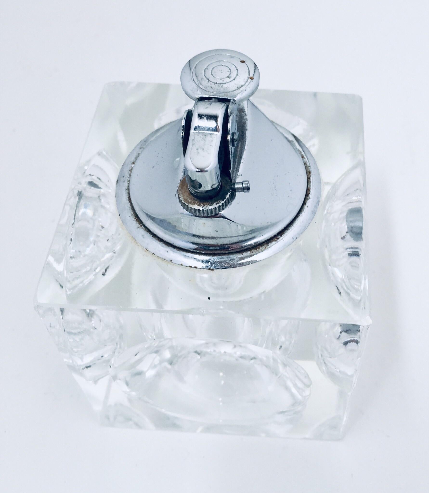 Vintage retro 1970s heavy cut glass cube table lighter-paperweight.
Mid-Century Modern retro square glass lighter with circle cut dimples.
A dramatic accent to any modern living room decor, this square lighter will elevate any coffee table or desk