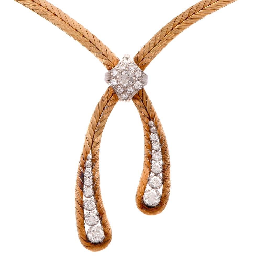 This vintage diamond bolo tie-esque choker necklace is crafted in 18K yellow gold. Displaying 22 round-cut diamonds approx. 1.60cts, H-I color, VSI clarity. Gold features a downward arrow patter throughout. Weighing 34 grams and measures 22 inches