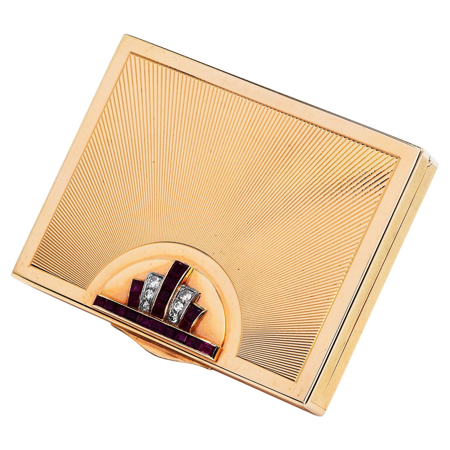 This retro authentic compact 14k Gold box, has a textured design with rubies & diamonds.
 it is crafted in solid 14K yellow gold, weighing 89.1 grams and measuring 2 3/4