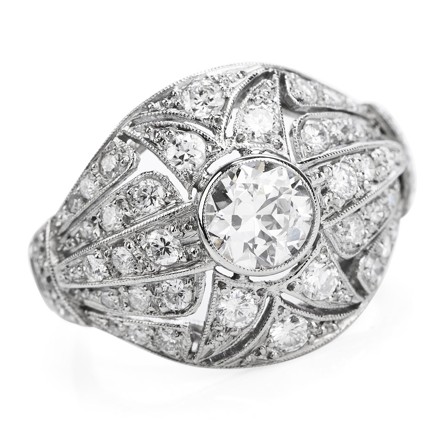 Take a step back in time with this Antique art deco Diamond Engagement ring crafted in luxurious platinum.
Intricate cut out and filagree patterns run throughout the top of this ring featuring one round European cut Diamond in the center weighing
