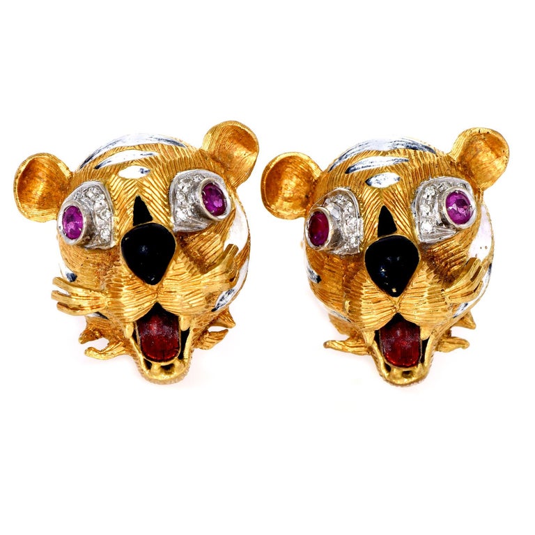 A celebration for the Tiger year!

These vintage retro tiger-inspired cufflinks are crafted in solid 18K yellow gold.

With 4 prominent Rubies on the eyes, each genuine ruby round-cut, bezel-set, cumulatively weighing 0.40 carats.

Each tiger has