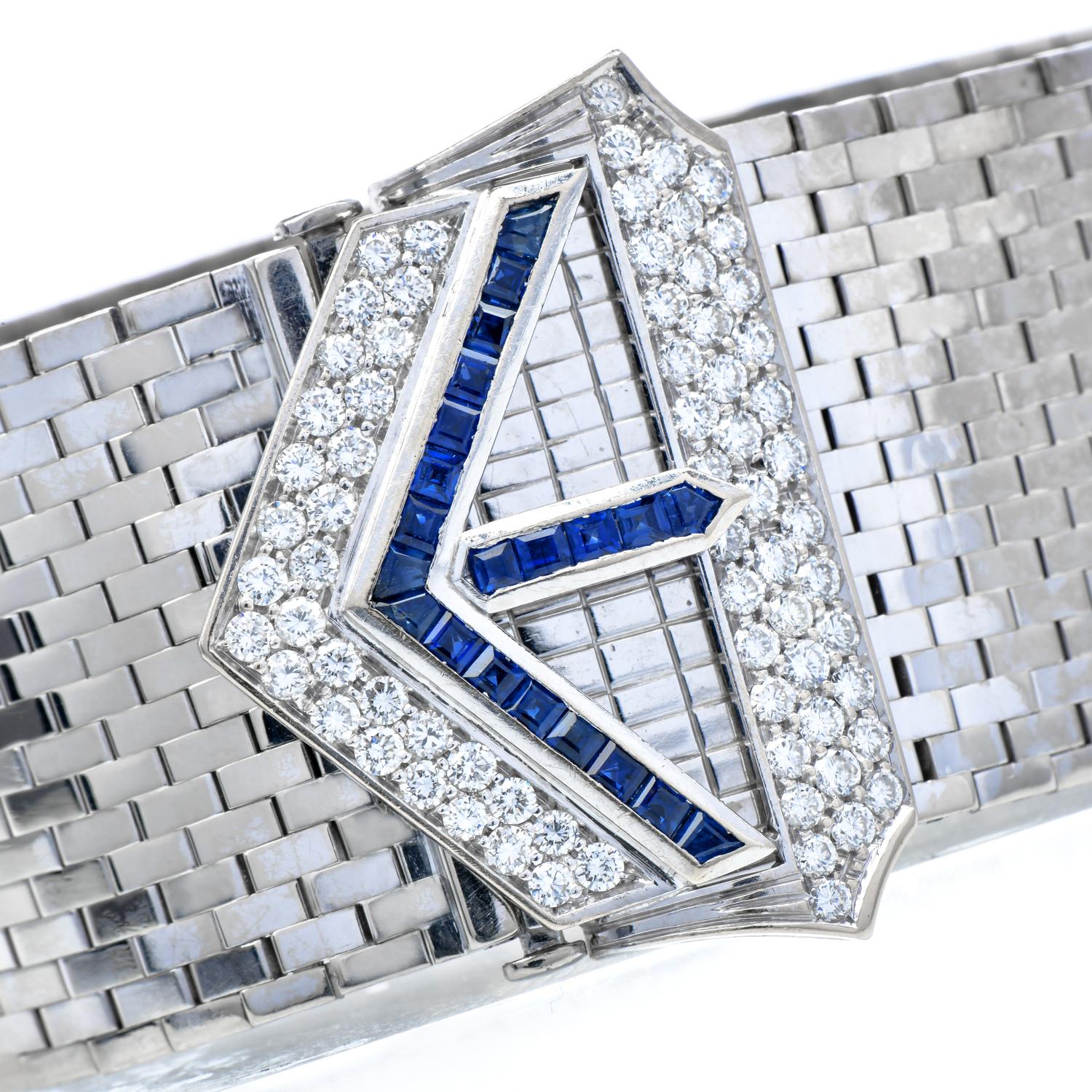 This opulent Vintage retro wide bracelet is crafted in 18-karat white gold, weighing 64.9 grams, measuring 7.3