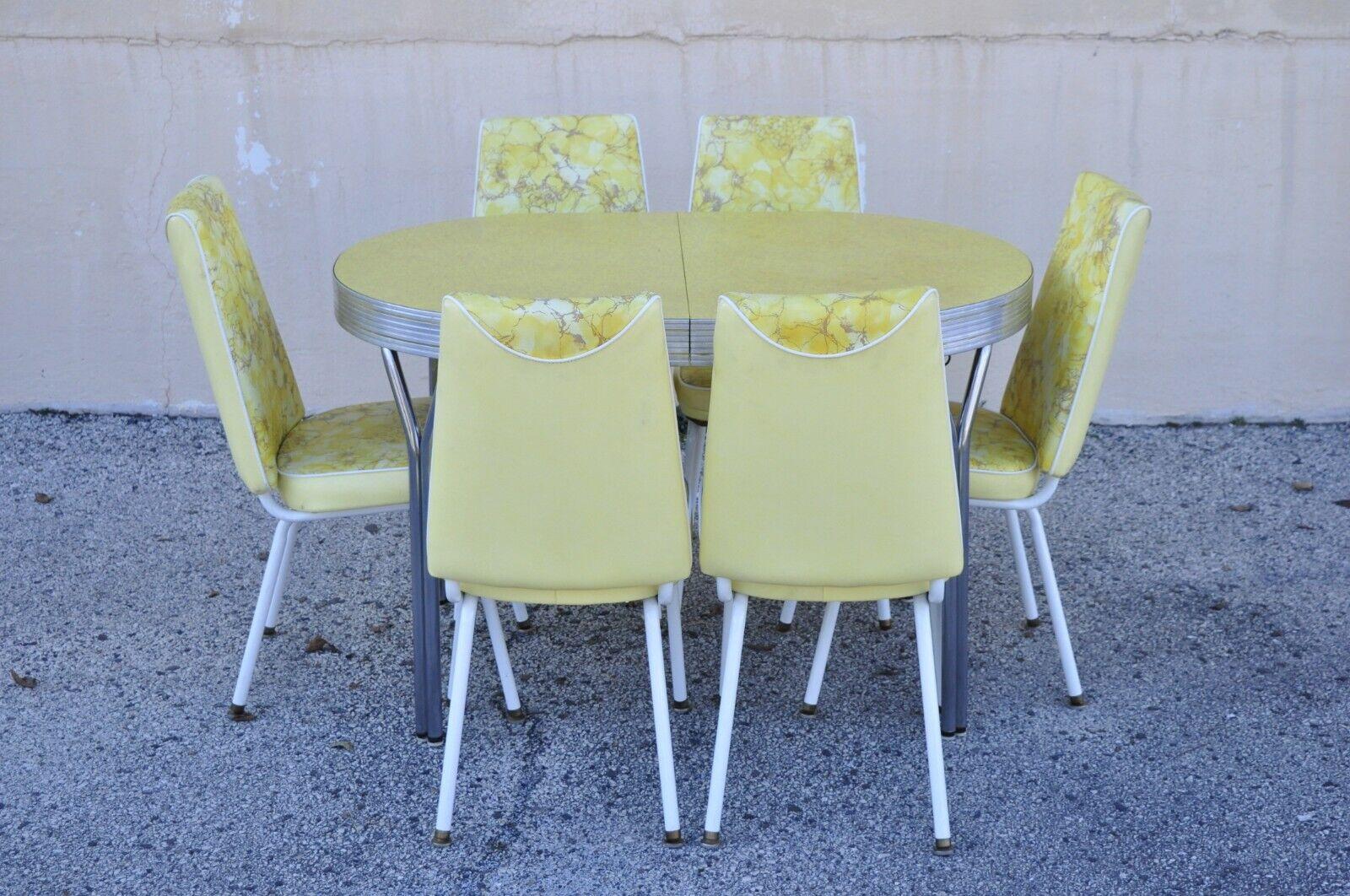 Vintage retro Douglas Furniture Co. yellow formica kitchen dinette set - 7 Pc Set. Item features 6 chairs, (1) table (no leaves), yellow floral print vinyl upholstery, oval formica table with metal legs, original label, very nice vintage set, circa