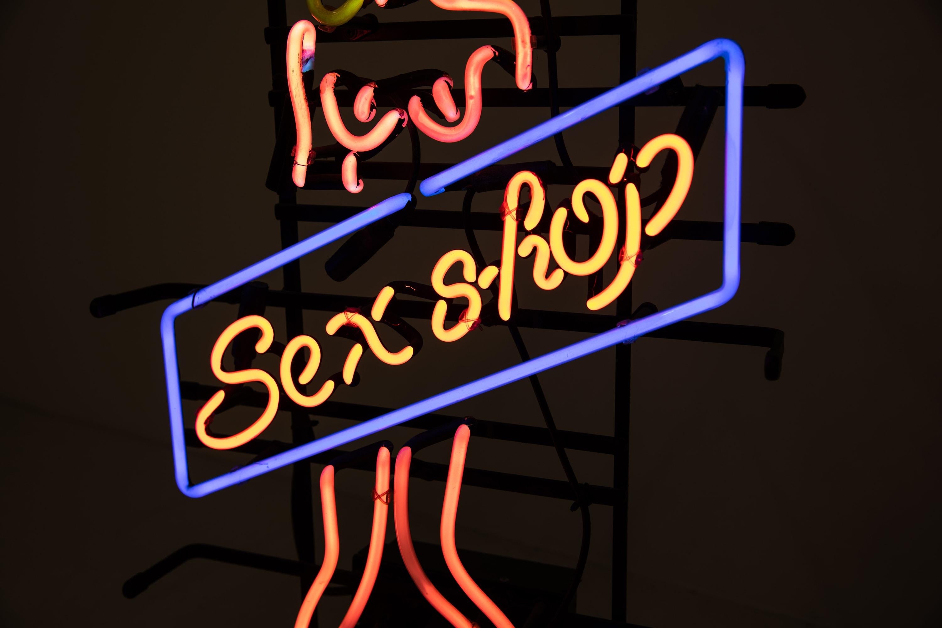 A very eye catching and attractive glass neon sign from a sex shop, circa 1970

Presented in a custom mount which allows the sign to be table/floor mounted or hung from a chain. The gas filled tubes illuminate as expected with an array of vibrant
