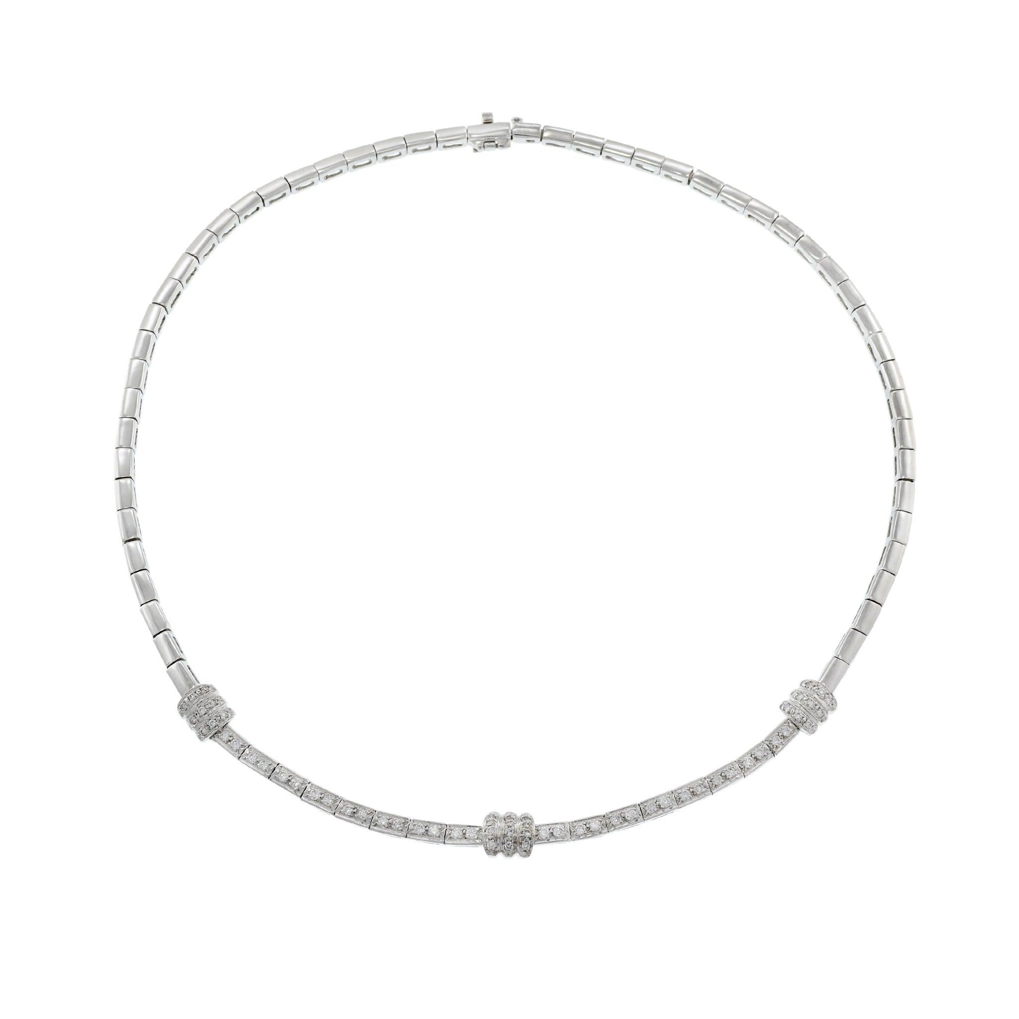 This elegant vintage retro era necklace is crafted in 14KT white gold and features 1.00 carat of round cut diamonds, set in a sophisticated link design. Weighing 28.23 grams, this piece offers a luxurious feel and timeless appeal. Perfect for adding