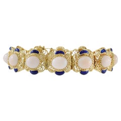 Bracciale vintage d'epoca retrò in oro giallo 18KT con pelle d'angelo, corallo e smalto blu