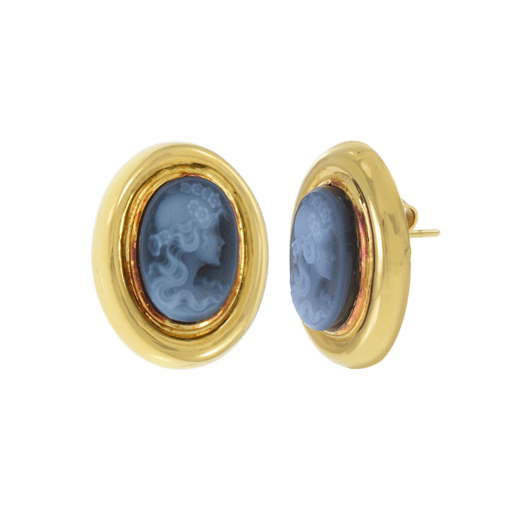 A refined pair of Retro clip-on earrings, each crafted in 18k yellow gold. Featuring blue agate stones, cut in a portrait style, elegantly set within the gold. Total weight is 7.2 grams.