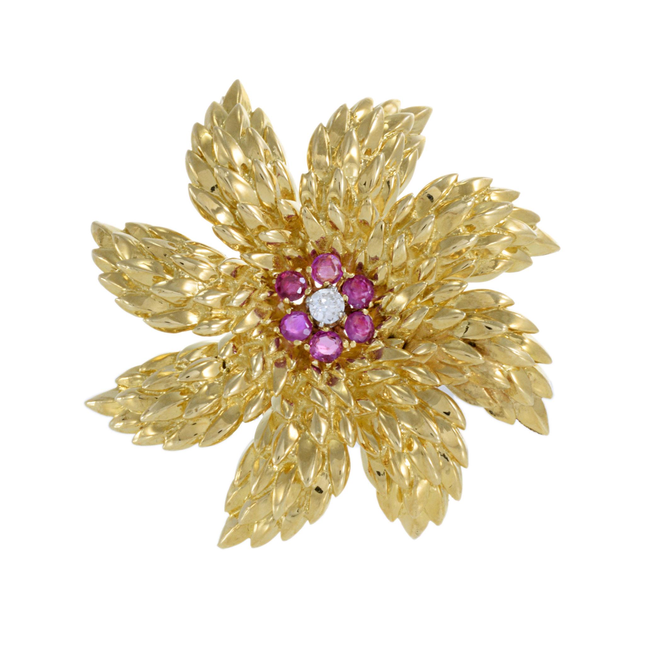 Vintage 18KT Yellow Gold Retro Era Tiffany & Co Flower Brooch, a stunning piece of jewelry exuding elegance and sophistication. This exquisite brooch features a vibrant array of rubies totaling 0.32 carats, beautifully complemented by a brilliant
