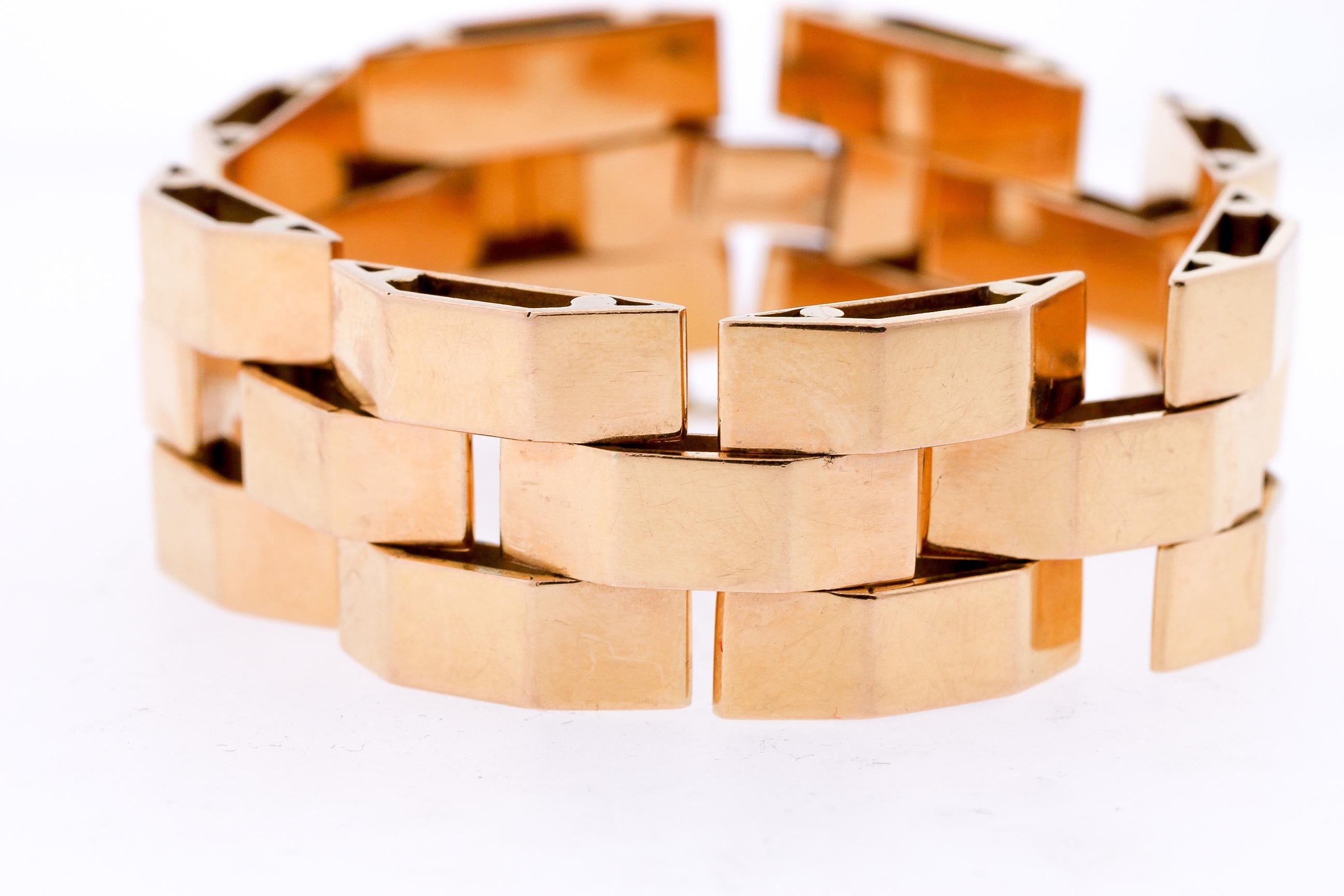 A wide vintage Retro 18k rose gold tank bracelet with French hallmarks, circa 1940. This bracelet is a classic example of a Retro tank bracelet, named after the tread of a tank. World War II greatly influenced jewelry design and styles, as women