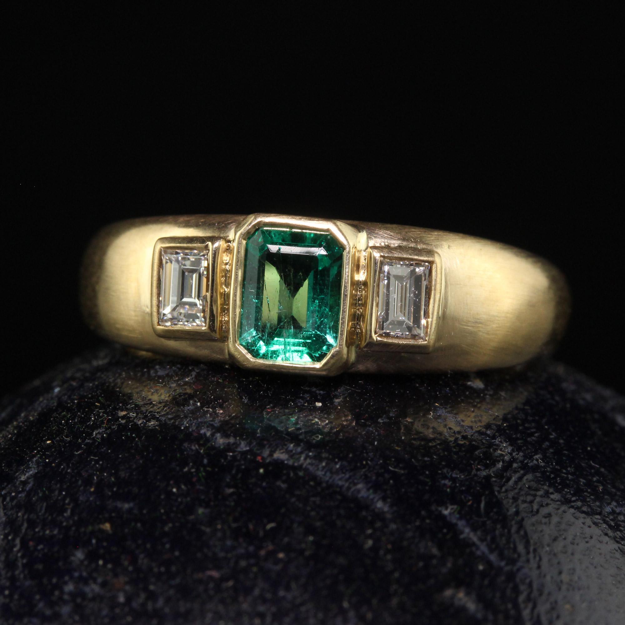 Beautiful Vintage Retro French 18K Yellow Gold Colombian Emerald Diamond Three Stone Ring. This gorgeous vintage French retro three stone ring is crafted in 18k yellow gold. The center holds a natural Colombian emerald and has two beautiful old cut