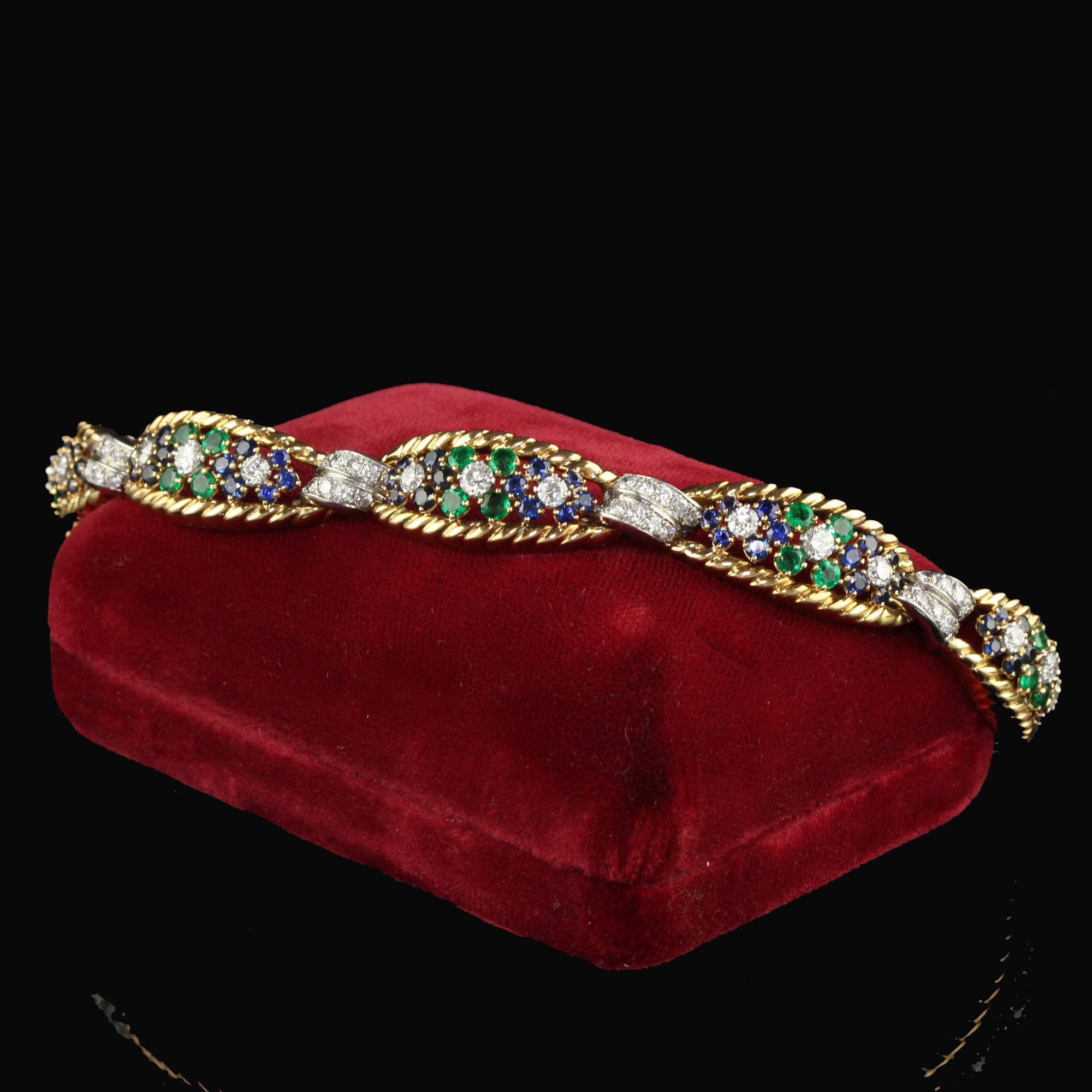 Beautiful Vintage Retro French 18K Yellow Gold Platinum Diamond Sapphire Emerald Bracelet. This incredible French Retro bracelet is crafted in 18k yellow gold and platinum. This bracelet features natural transitional cut diamonds, emeralds, and