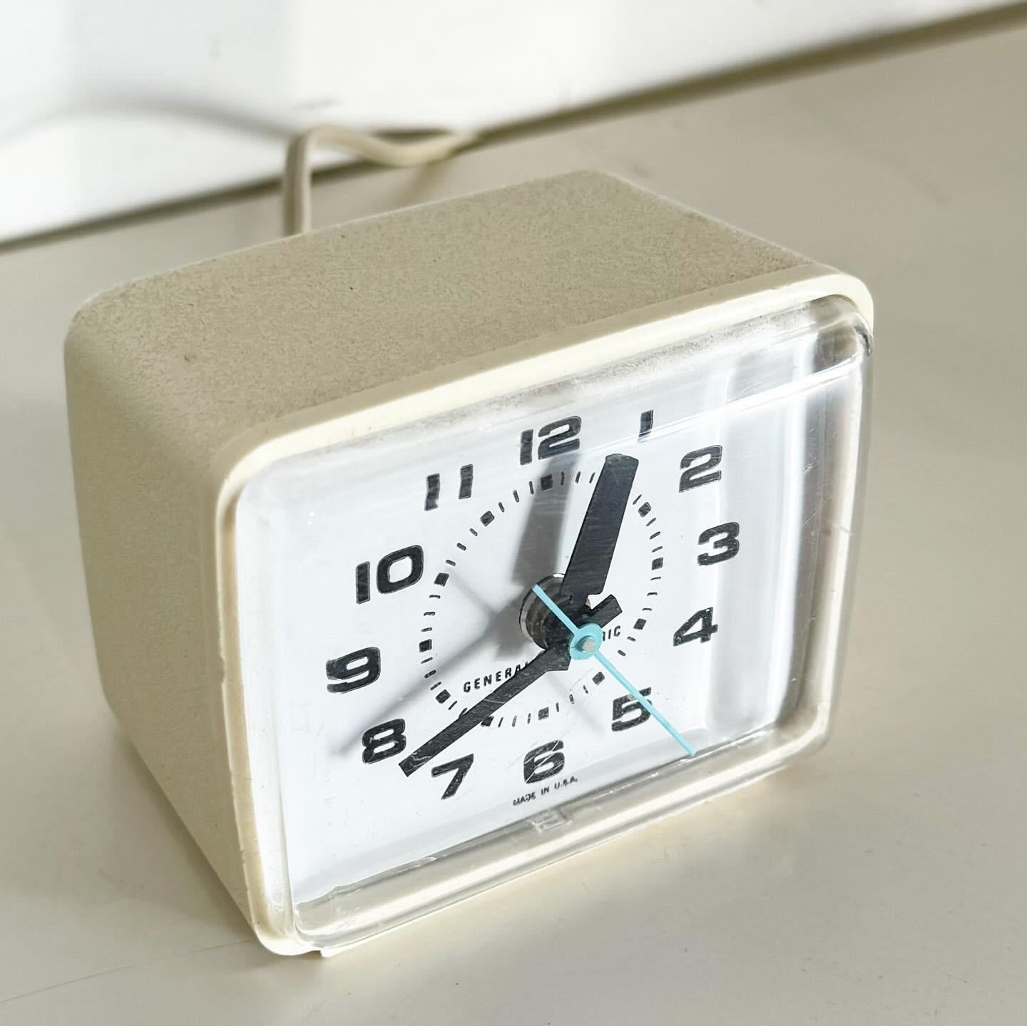 Revel in the nostalgia with the Vintage GE Teal Alarm Clock, model 7369, in teal blue. This mid-century modern gem combines bold design with functionality, featuring a vibrant teal casing and a clear dial for easy reading. Perfect for adding a pop