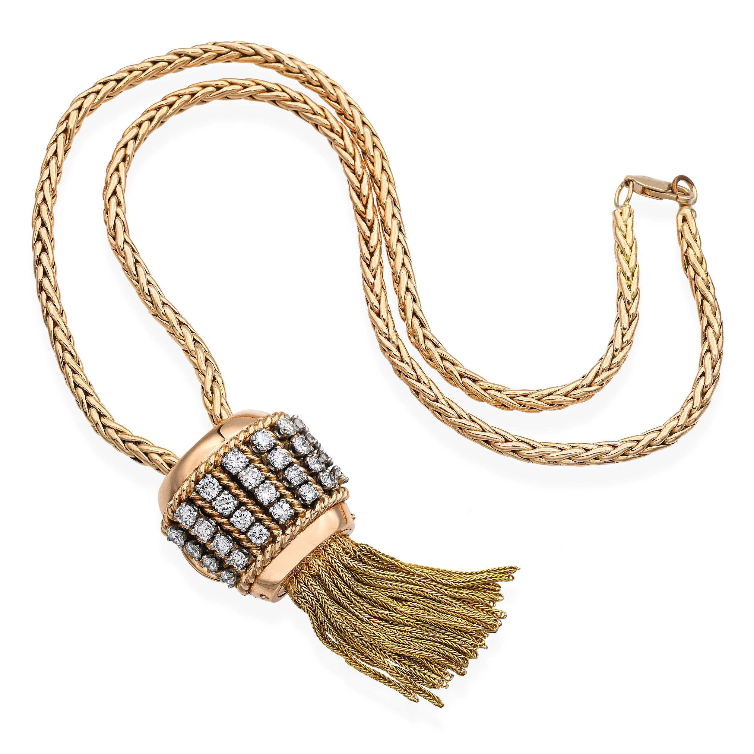 This exquisite necklace by Maison Sasportas is a striking example of mid-century French elegance, crafted in richly textured 18k yellow gold and set with rows of brilliant-cut diamonds. The centerpiece—a bold, sculptural tassel motif—features a