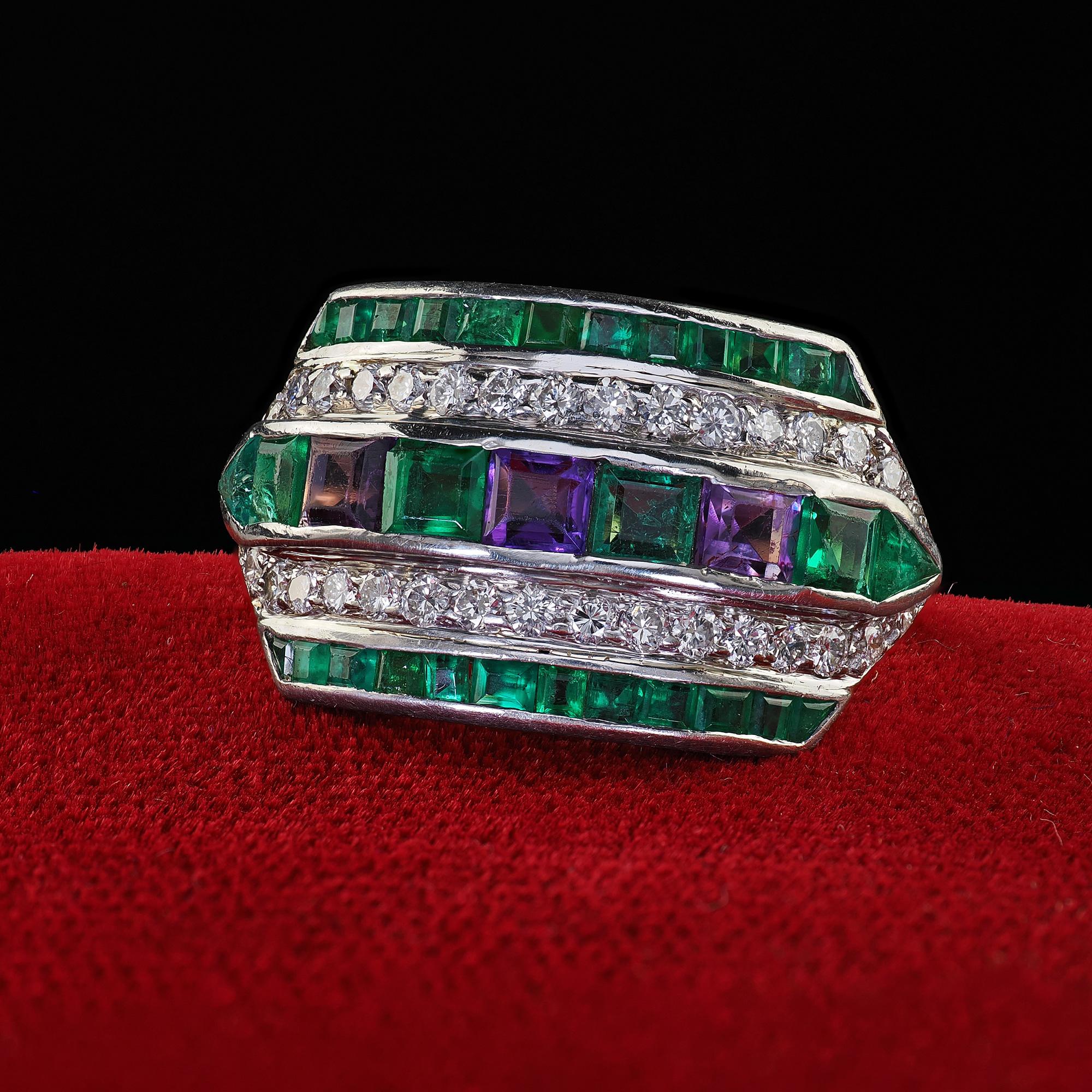 Beautiful Vintage Retro Maurice Tishman 18K Gold Platinum Diamond Emerald Amethyst Ring. This gorgeous vintage Maurice Tishman ring is crafted in 18k yellow gold and platinum. The ring features a gorgeous arrangement of emeralds, amethysts, and